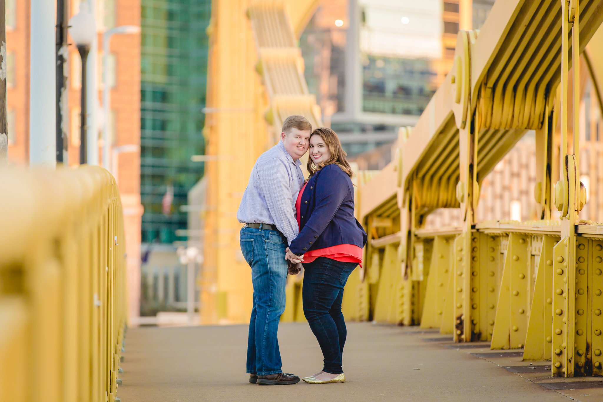 Engagement photos on the Roberto Clemente Bridge in Pittsburgh