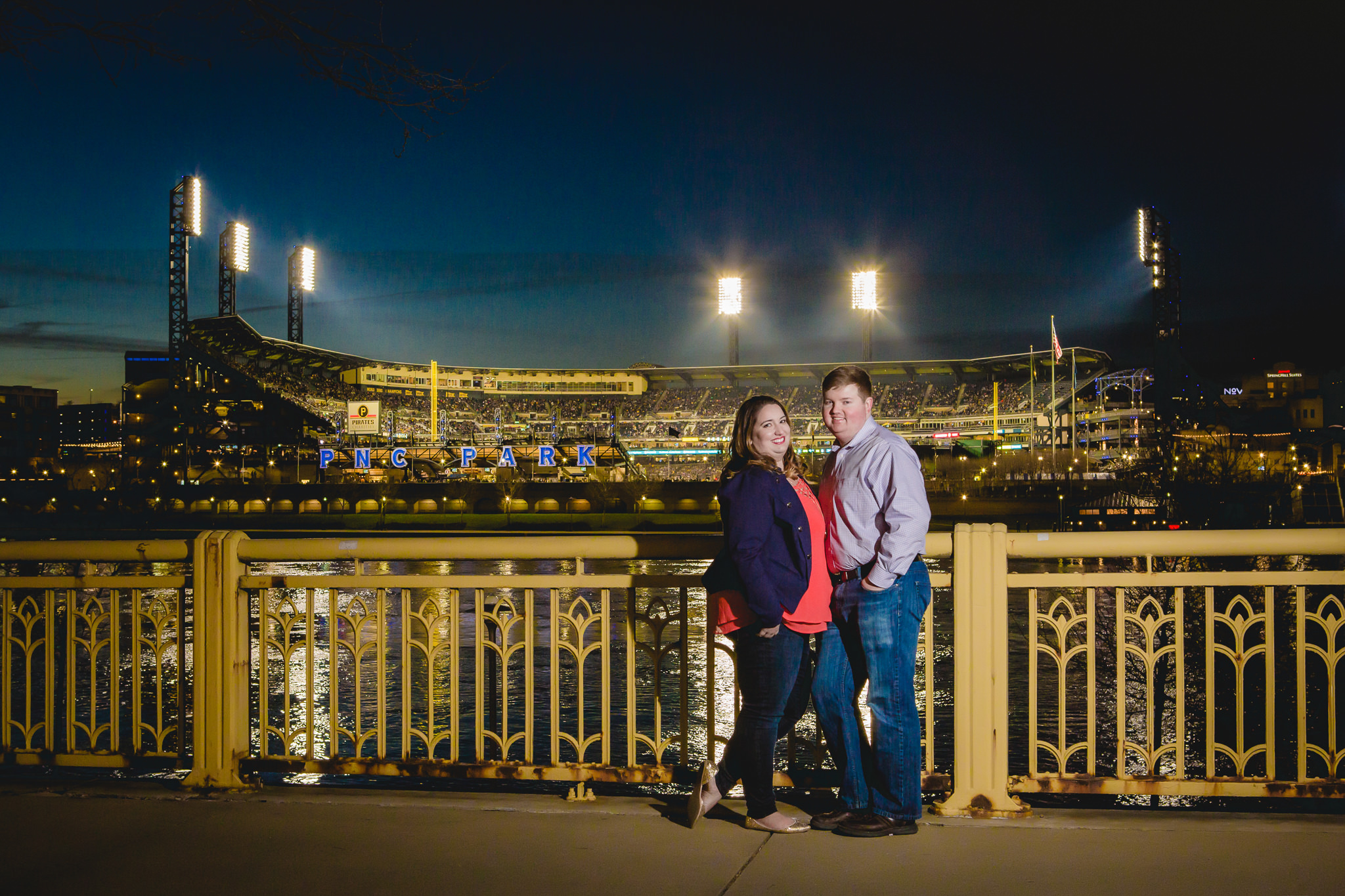 Engagement pictures at night during a Pirates game at PNC Park