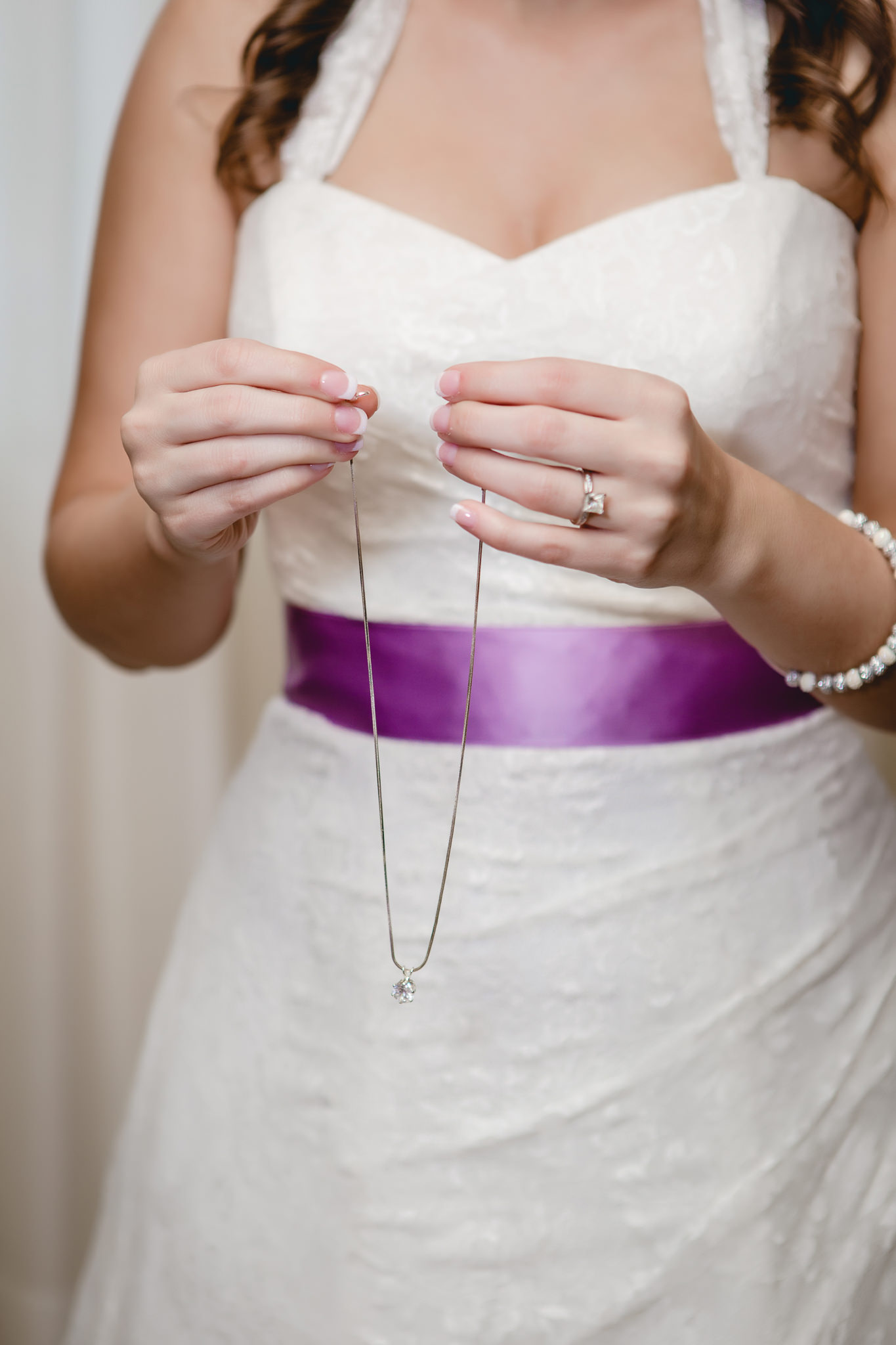 Pittsburgh bride putting on her necklace before her St. Malachy wedding ceremony