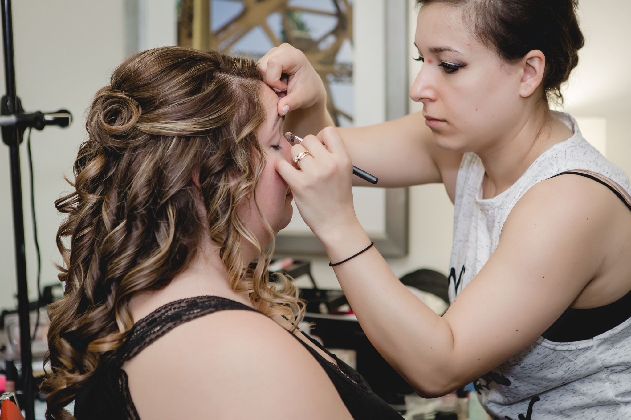 Bride getting makeup done before her Pittsburgh wedding at Soldiers & Sailors