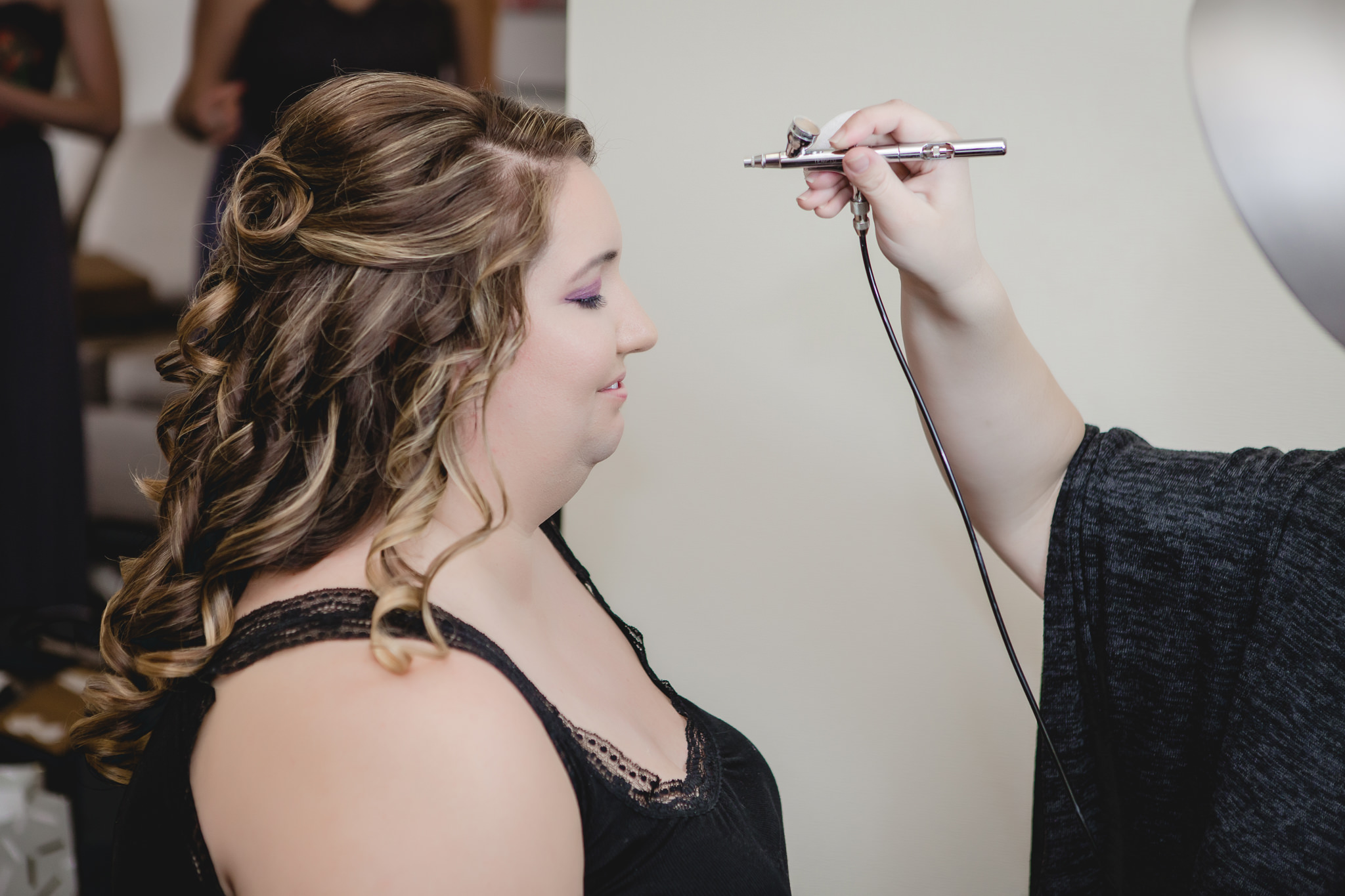 Bride getting airbrushed before her Pittsburgh wedding at Soldiers & Sailors