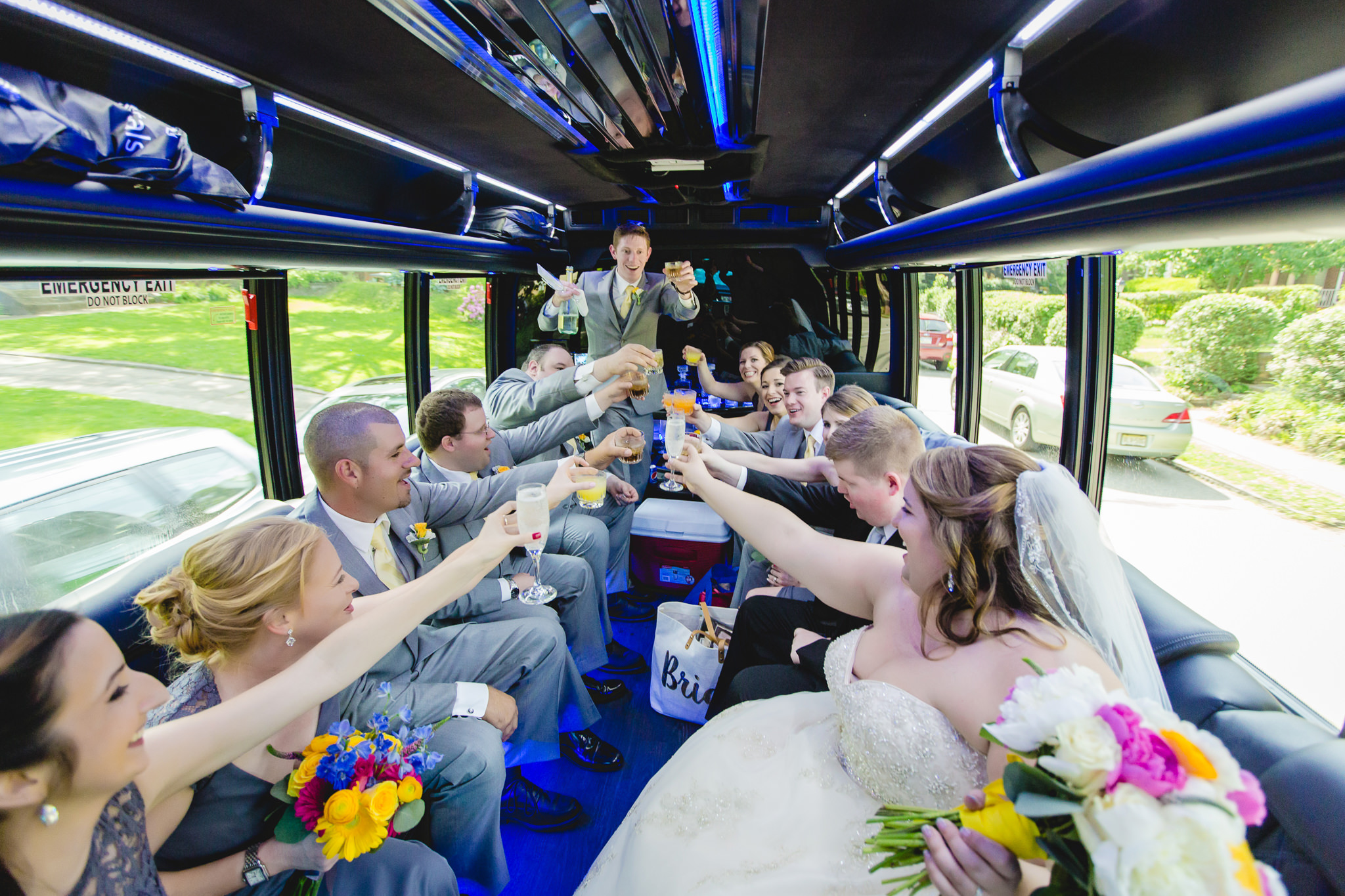 Wedding party toasts on a limo in Pittsburgh
