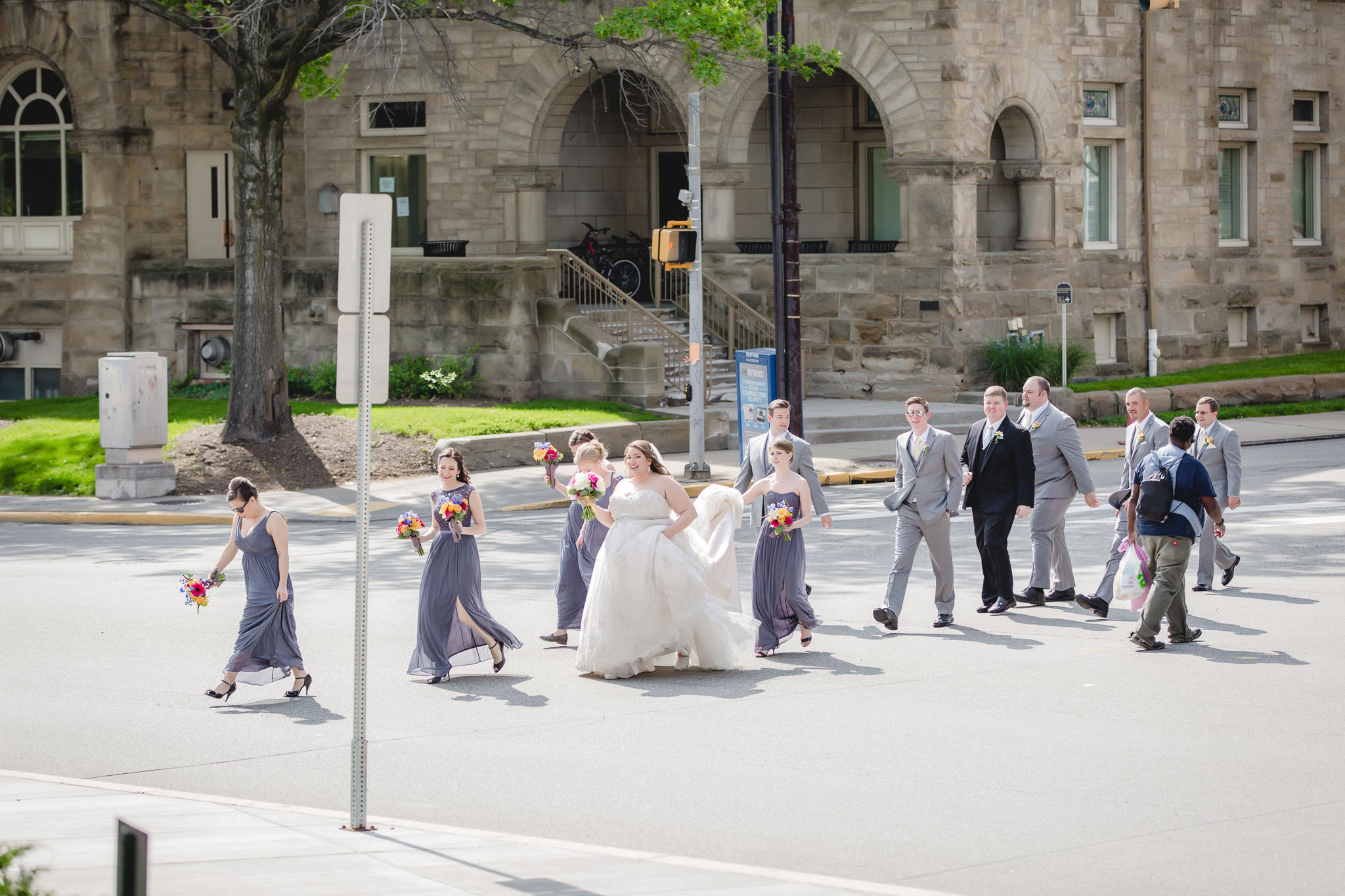 Wedding party crosses the street in Oakland Pittsburgh