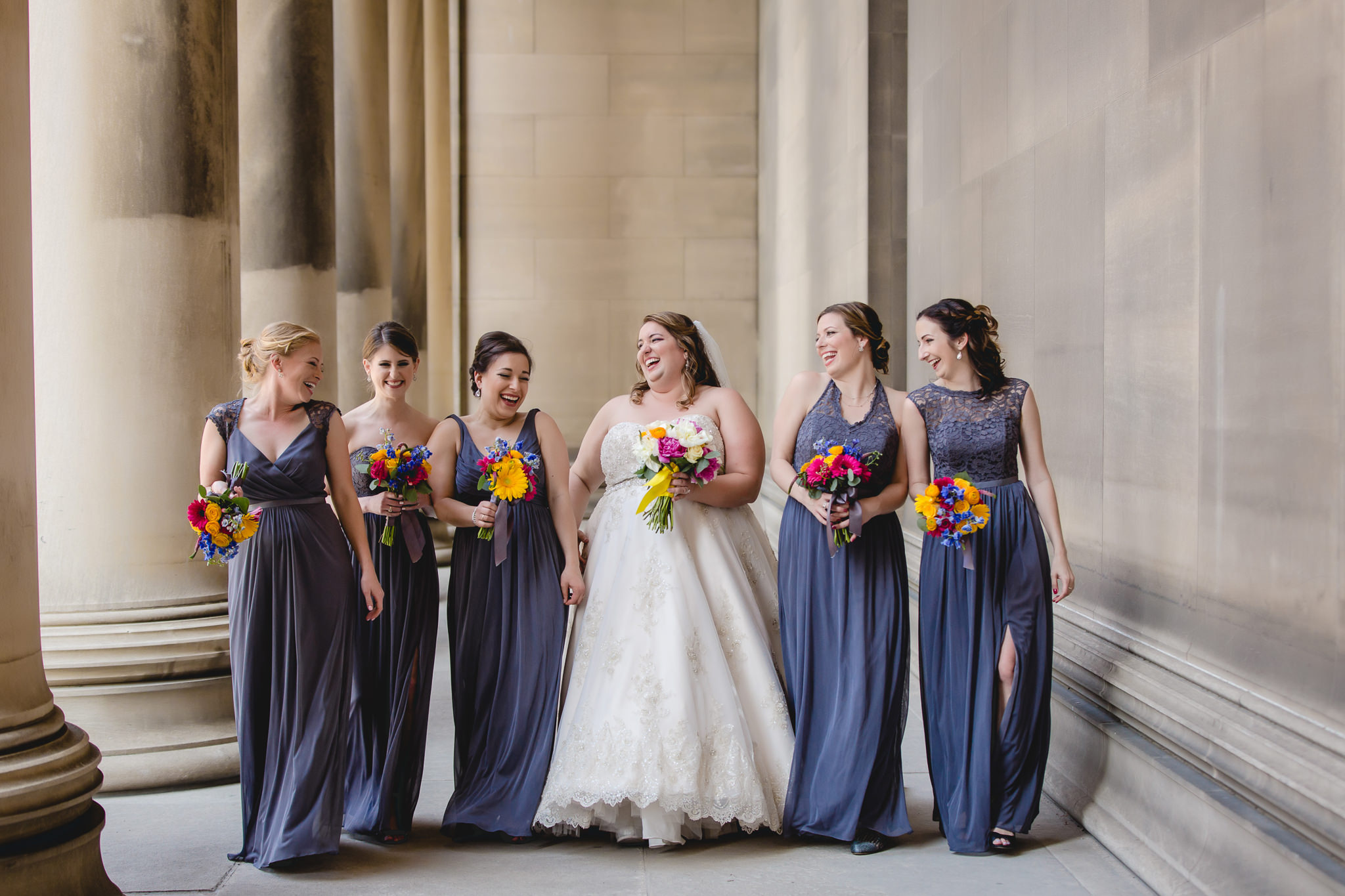 Bride laughing with bridesmaids before a Soldiers & Sailors wedding reception