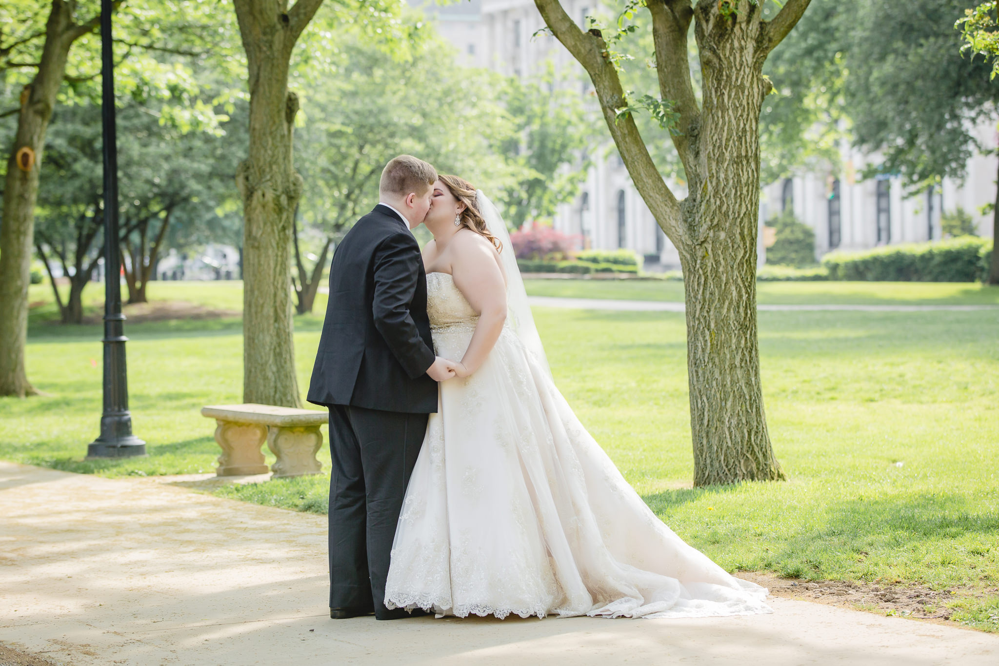 Bride and groom kissing near Heinz Chapel in Oakland Pittsburgh