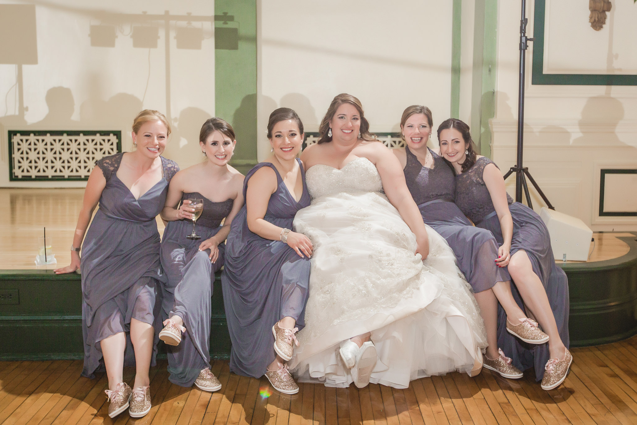 Bridesmaids show off their shoes at Soldiers & Sailors