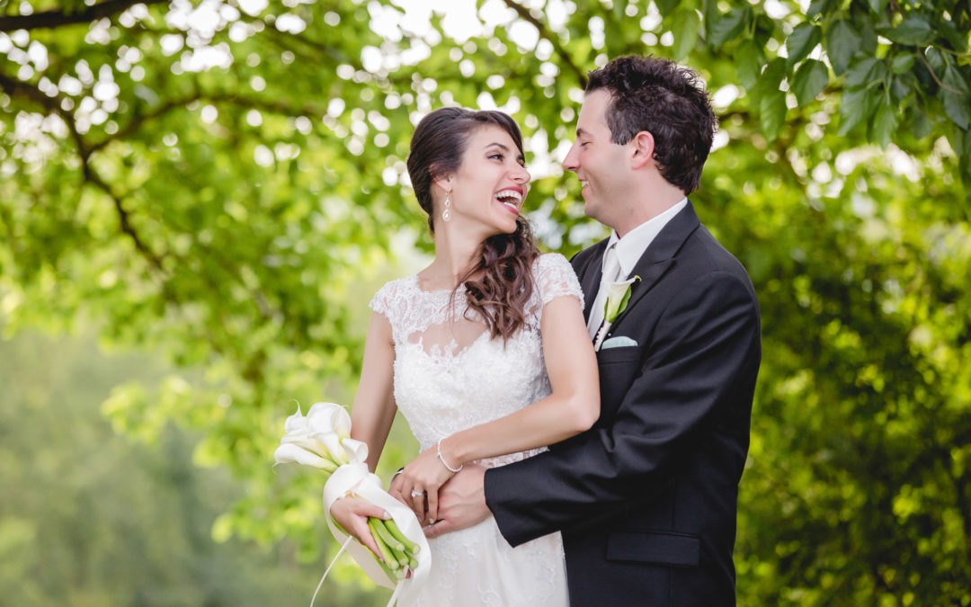 Bride laughs with her groom during photos at Greystone Fields