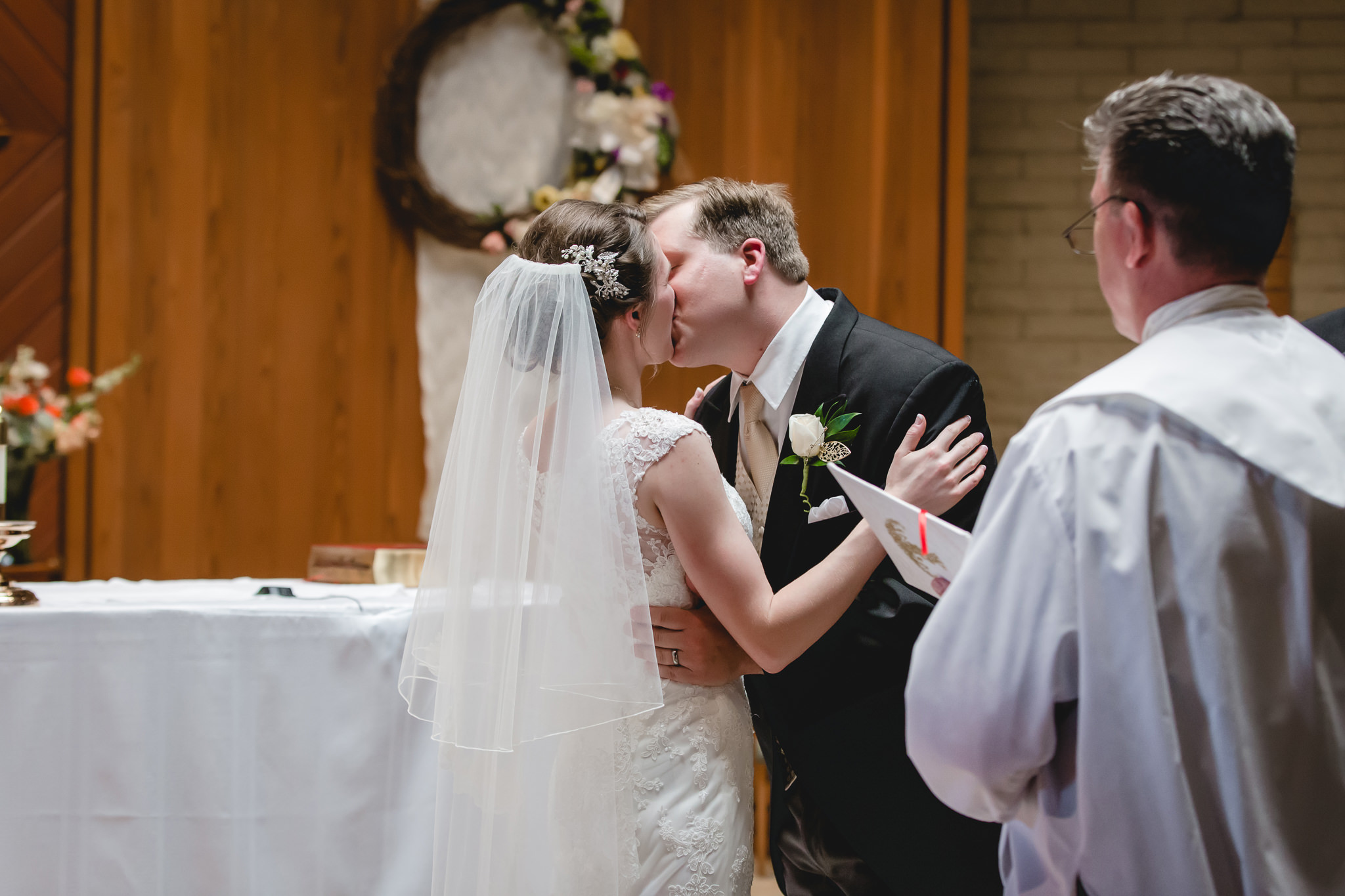 Bride & groom's first kiss at St. John Neumann Church in Pittsburgh PA