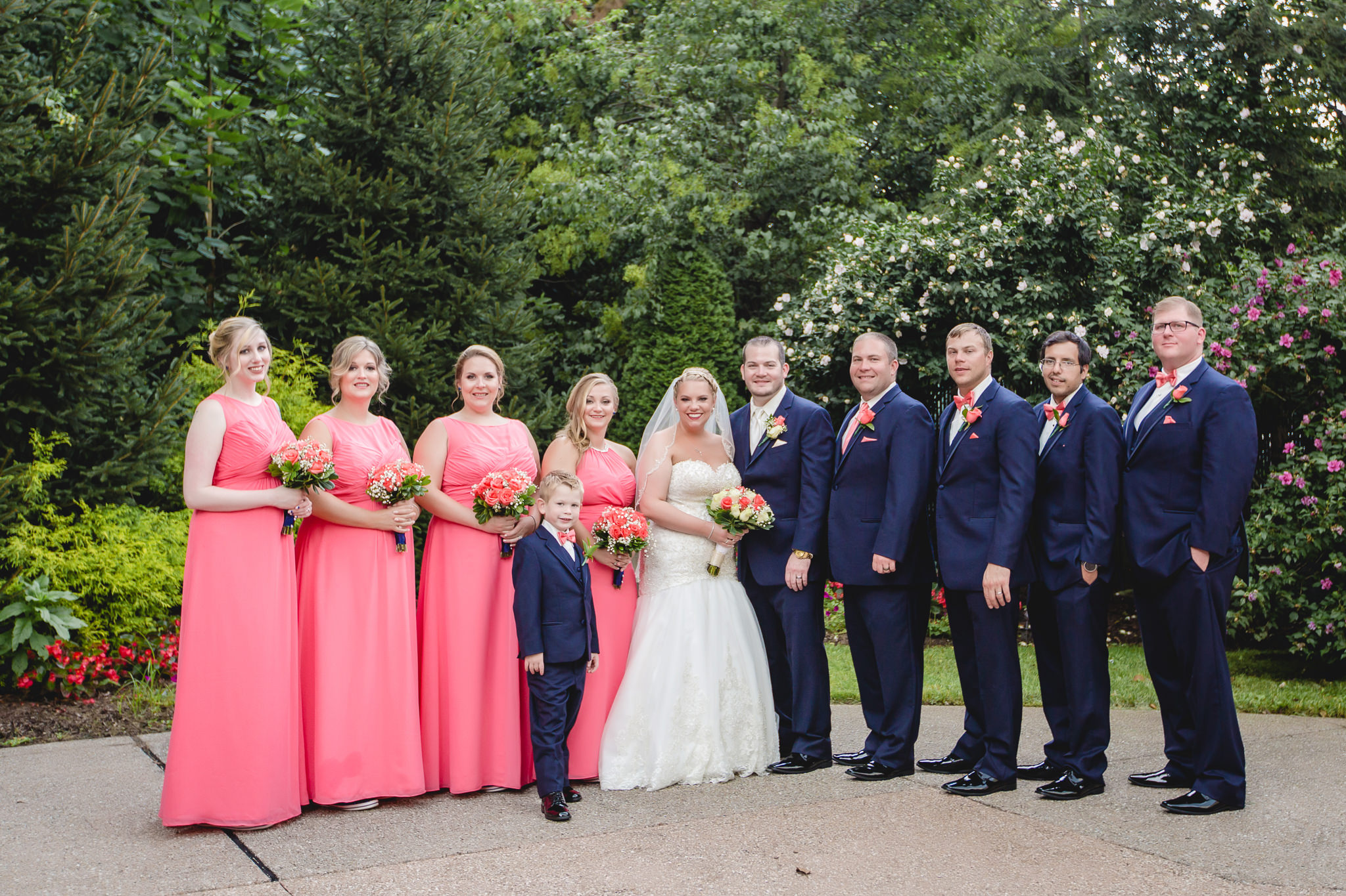 Bridal party poses in the courtyard of the Pittsburgh Airport Marriott