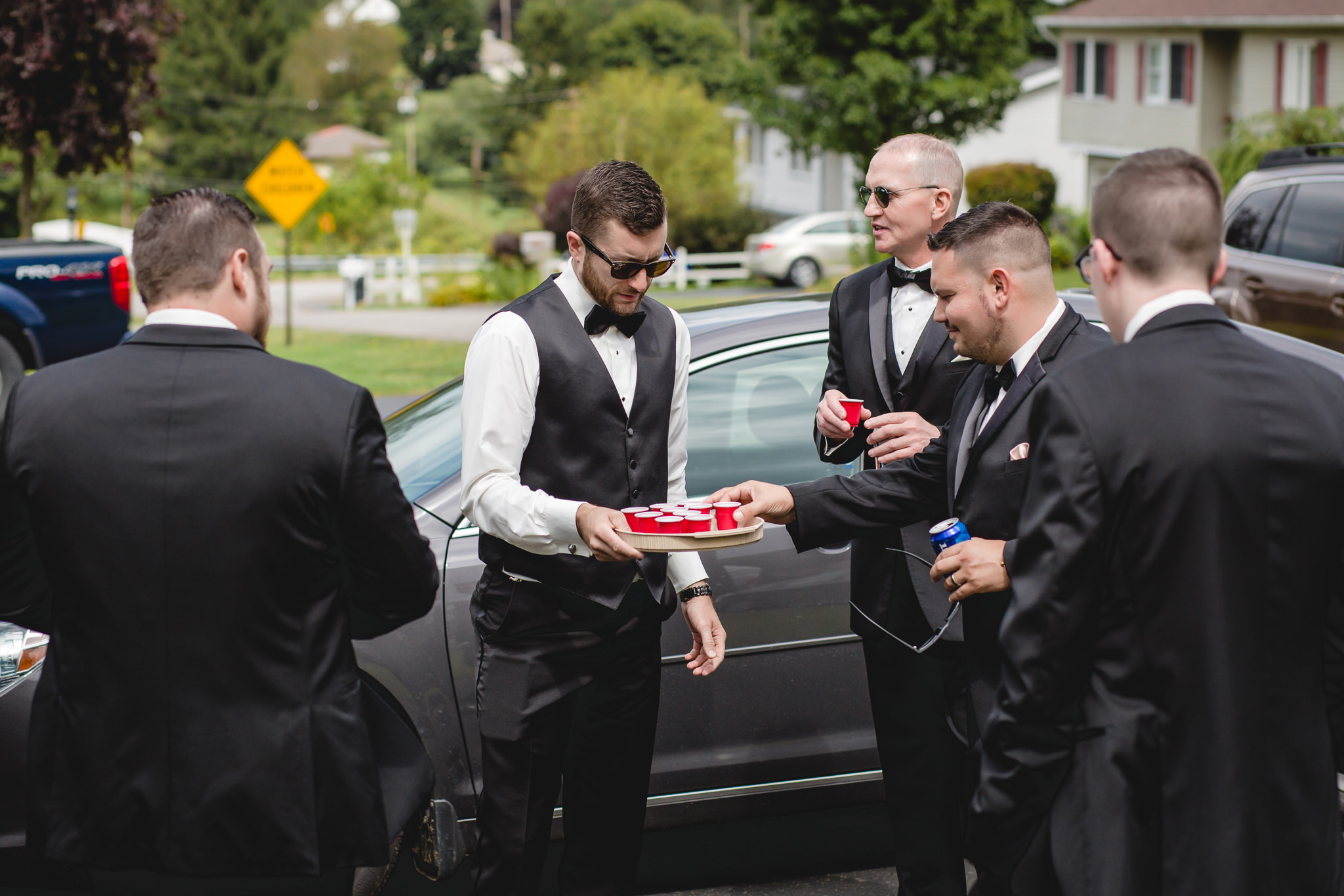 Groomsmen having drinks before a Gathering Place at Darlington Lake wedding