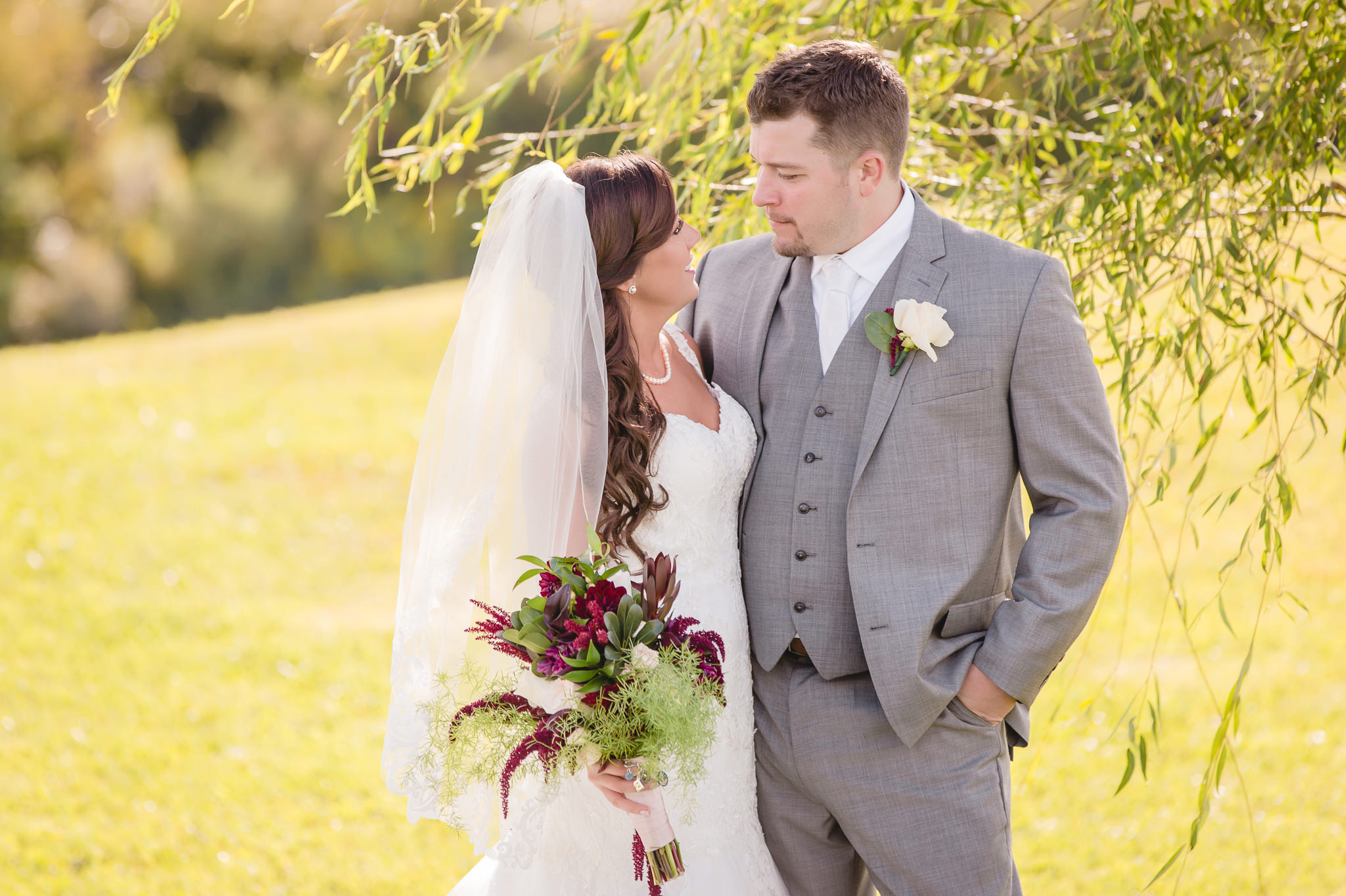 Bride and groom share a moment at White Barn