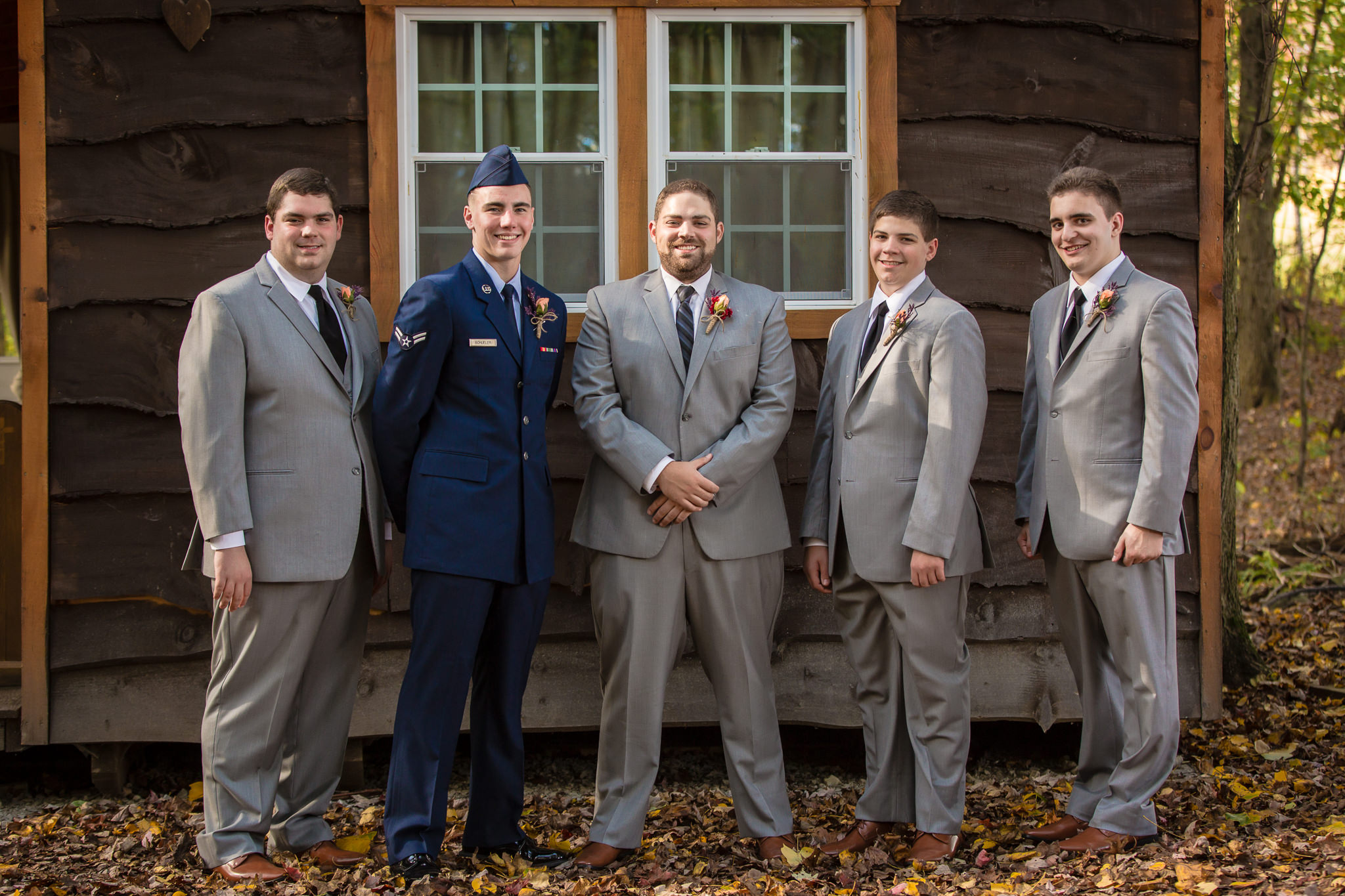 Groom poses with his groomsmen at the Barn at Soergel Hollow