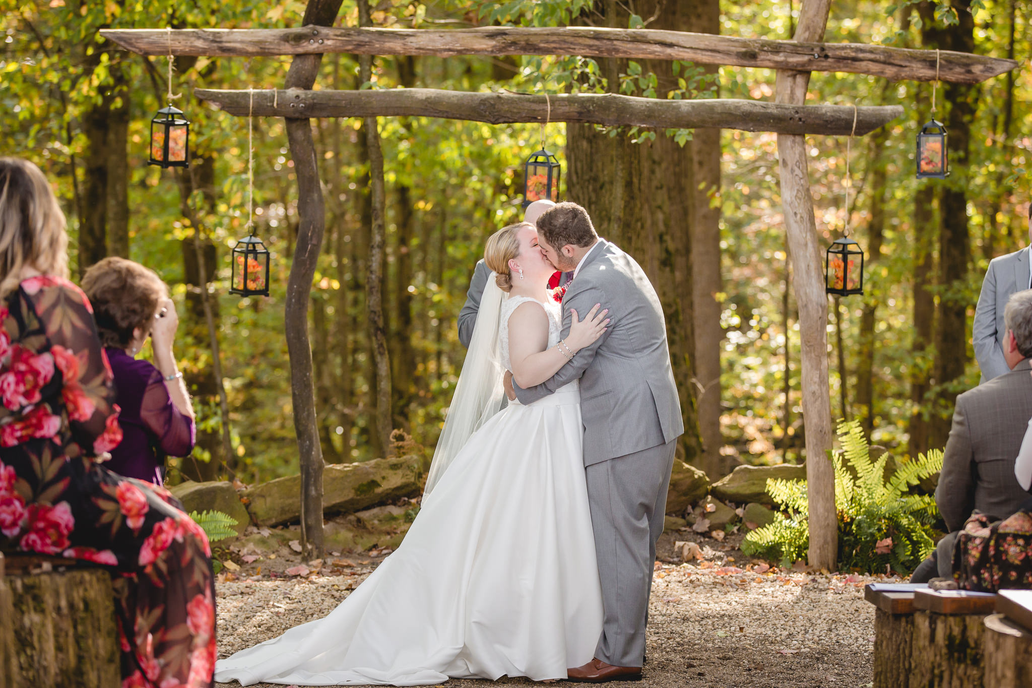 Bride and groom's first kiss at the Barn at Soergel Hollow