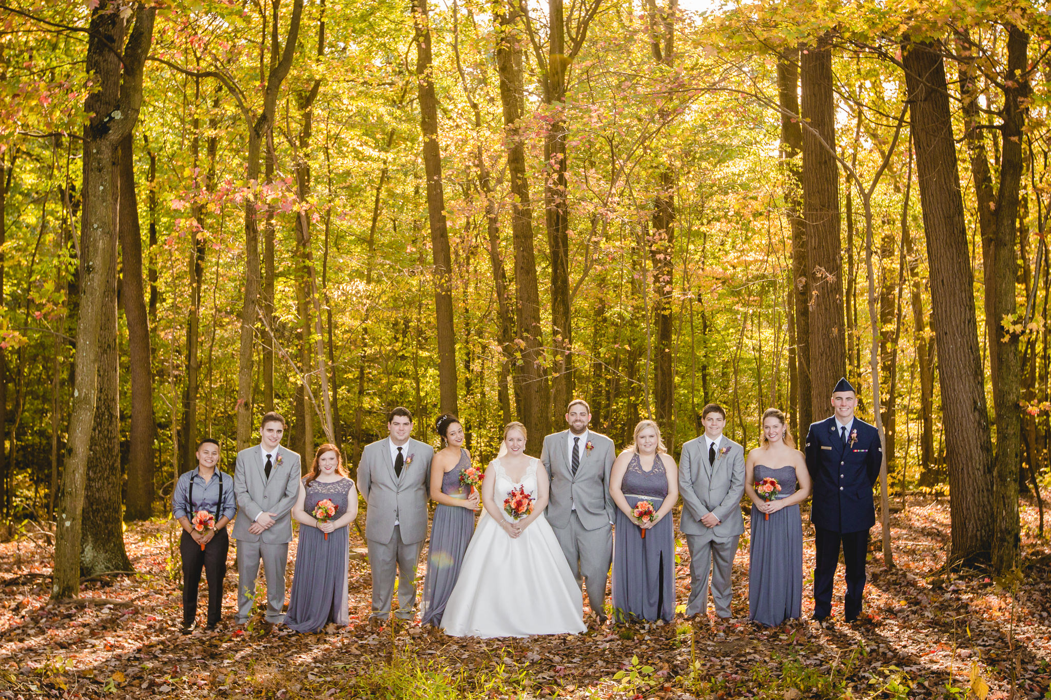Bridal party pose in the woods during golden hour at the Barn at Soergel Hollow