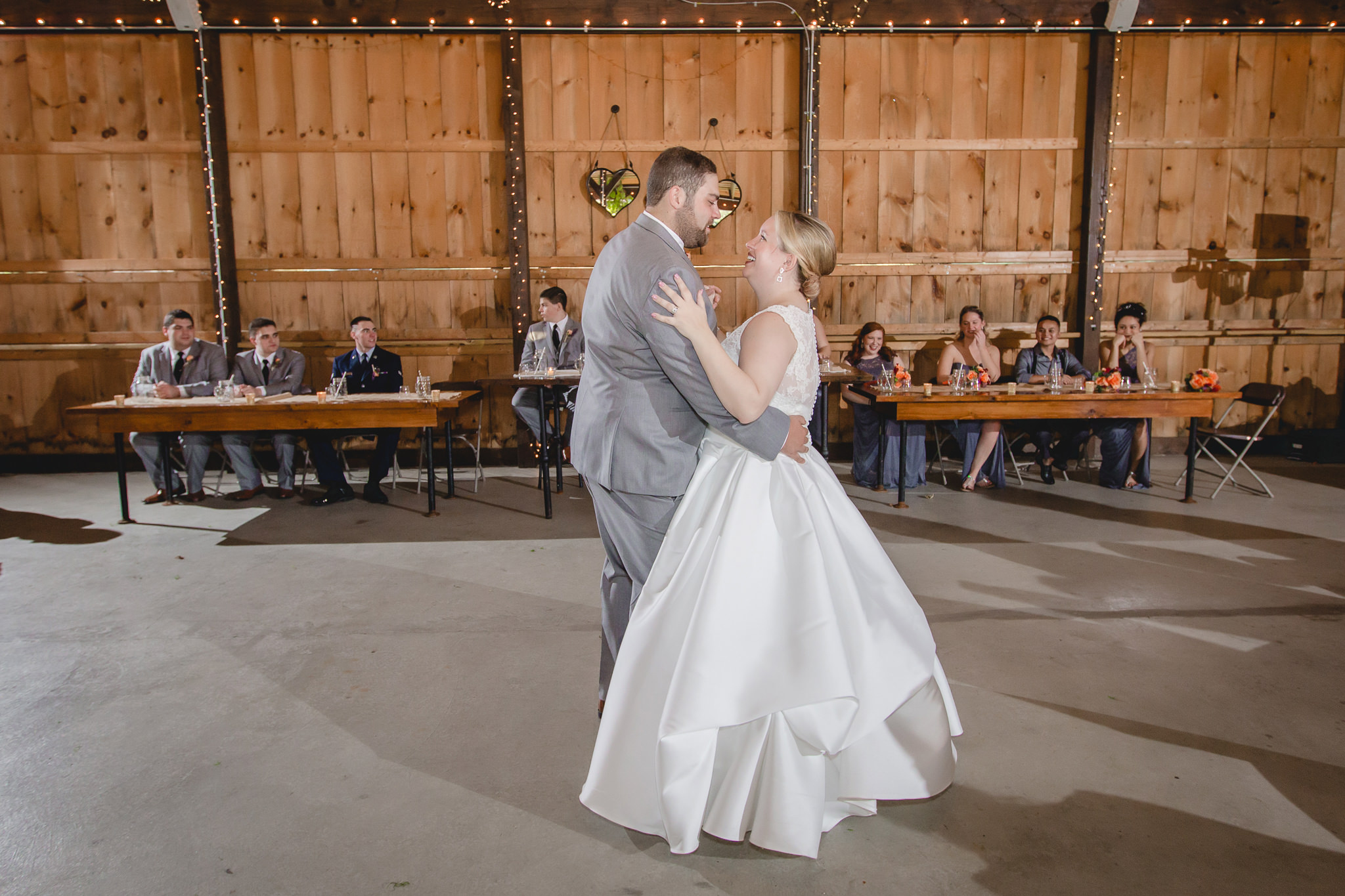 Newlyweds share their first dance at their Barn at Soergel Hollow wedding reception