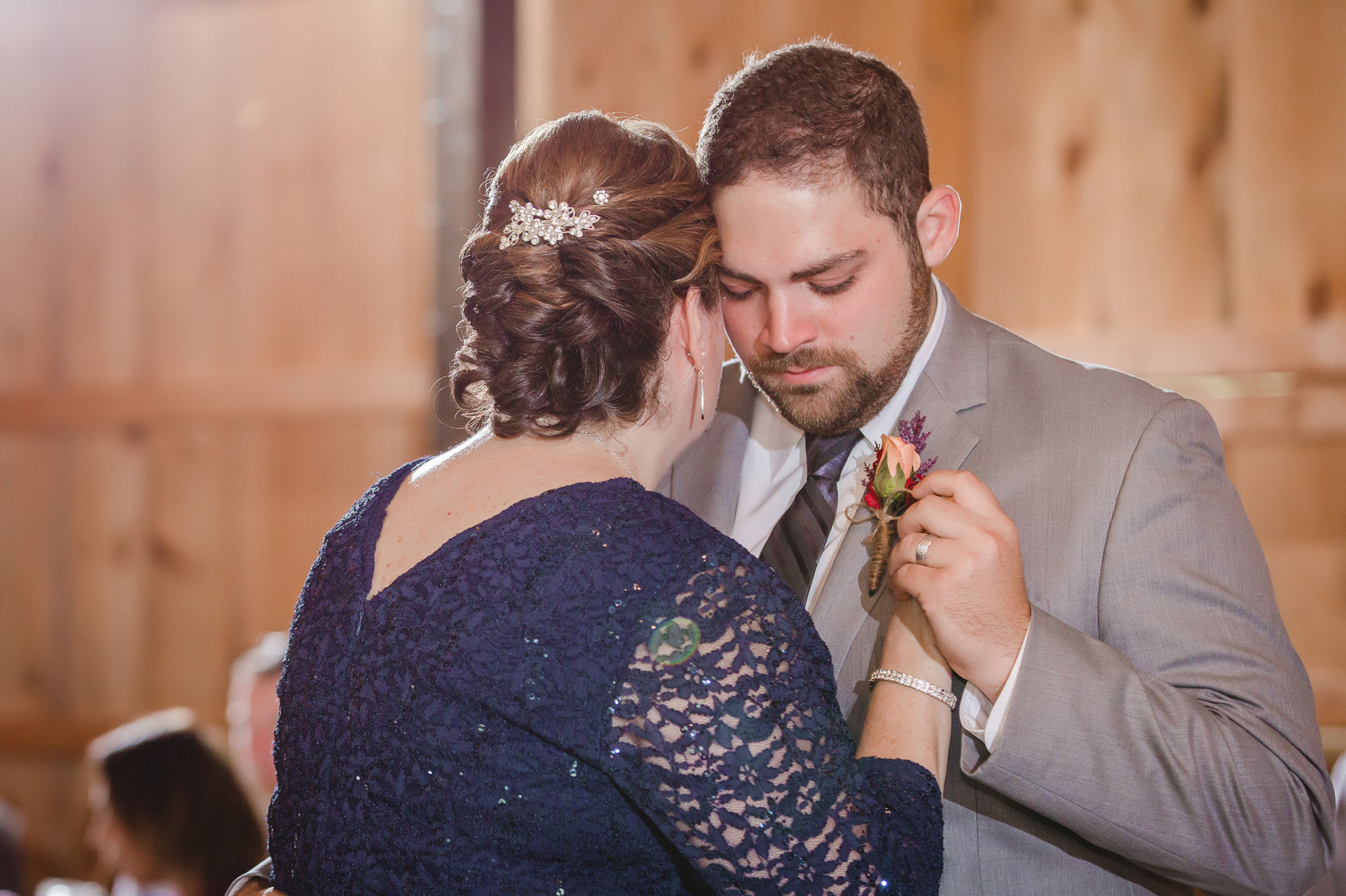 Mother of the groom dances with her son at the Barn at Soergel Hollow