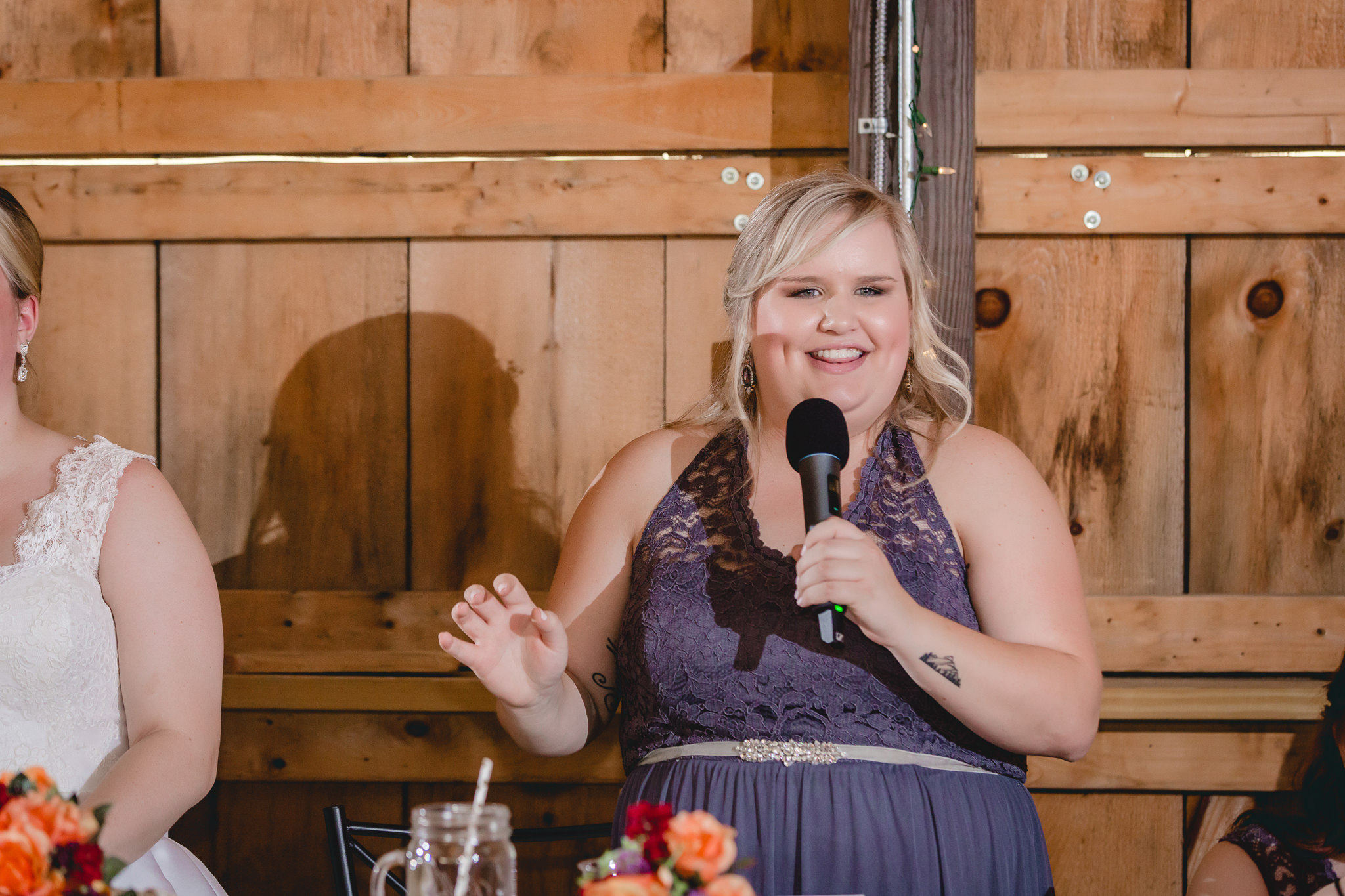 Maid of honor gives a speech at a wedding reception at the Barn at Soergel Hollow