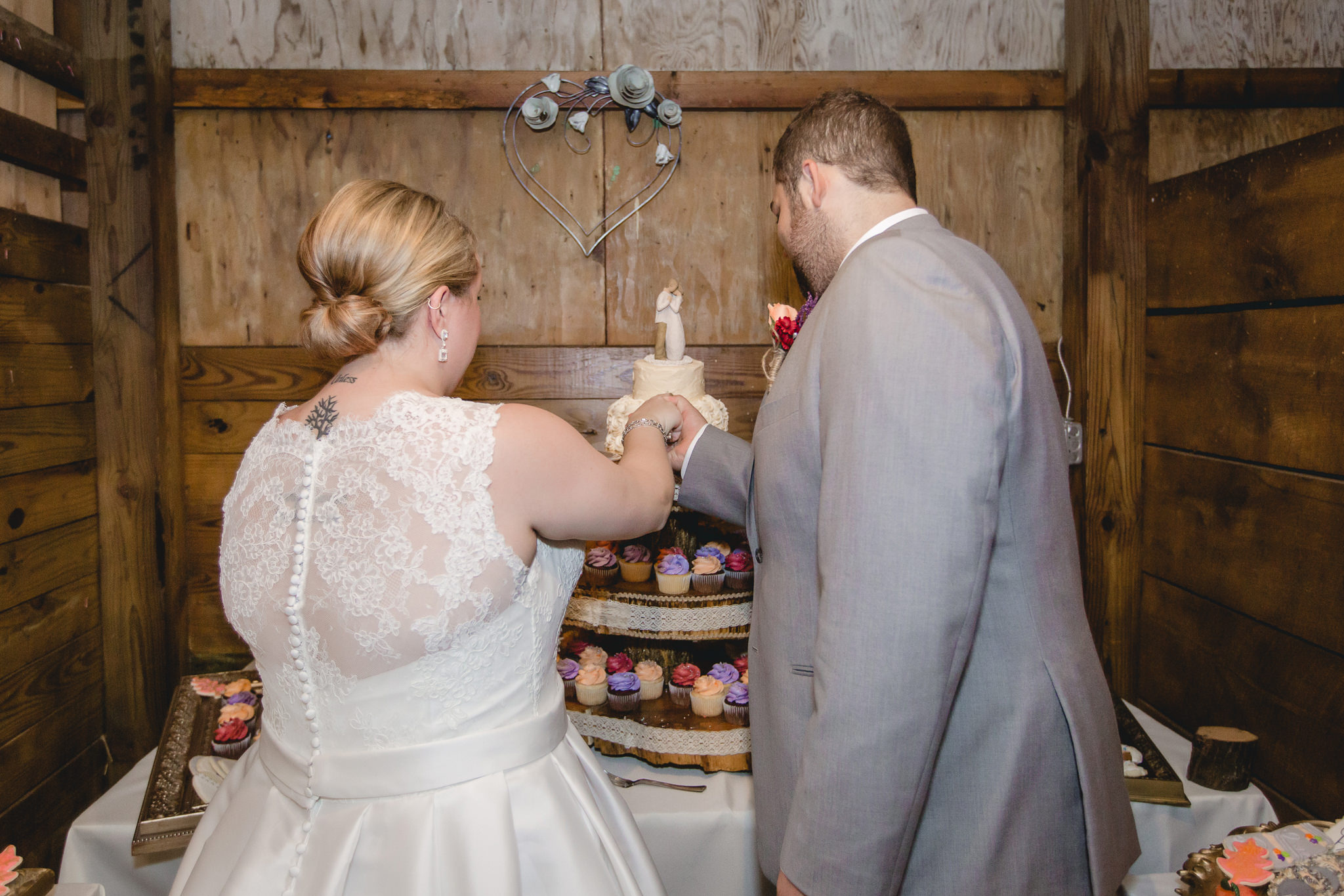 Bride and groom cut the cake at the Barn at Soergel Hollow