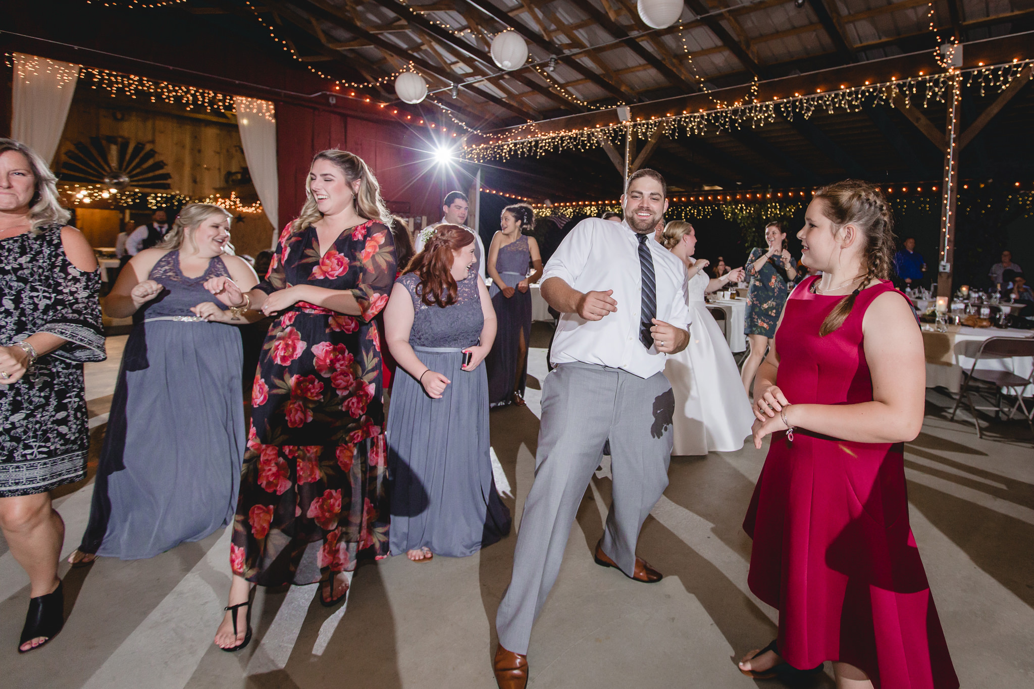 Groom dances with guests at his Barn at Soergel Hollow wedding reception