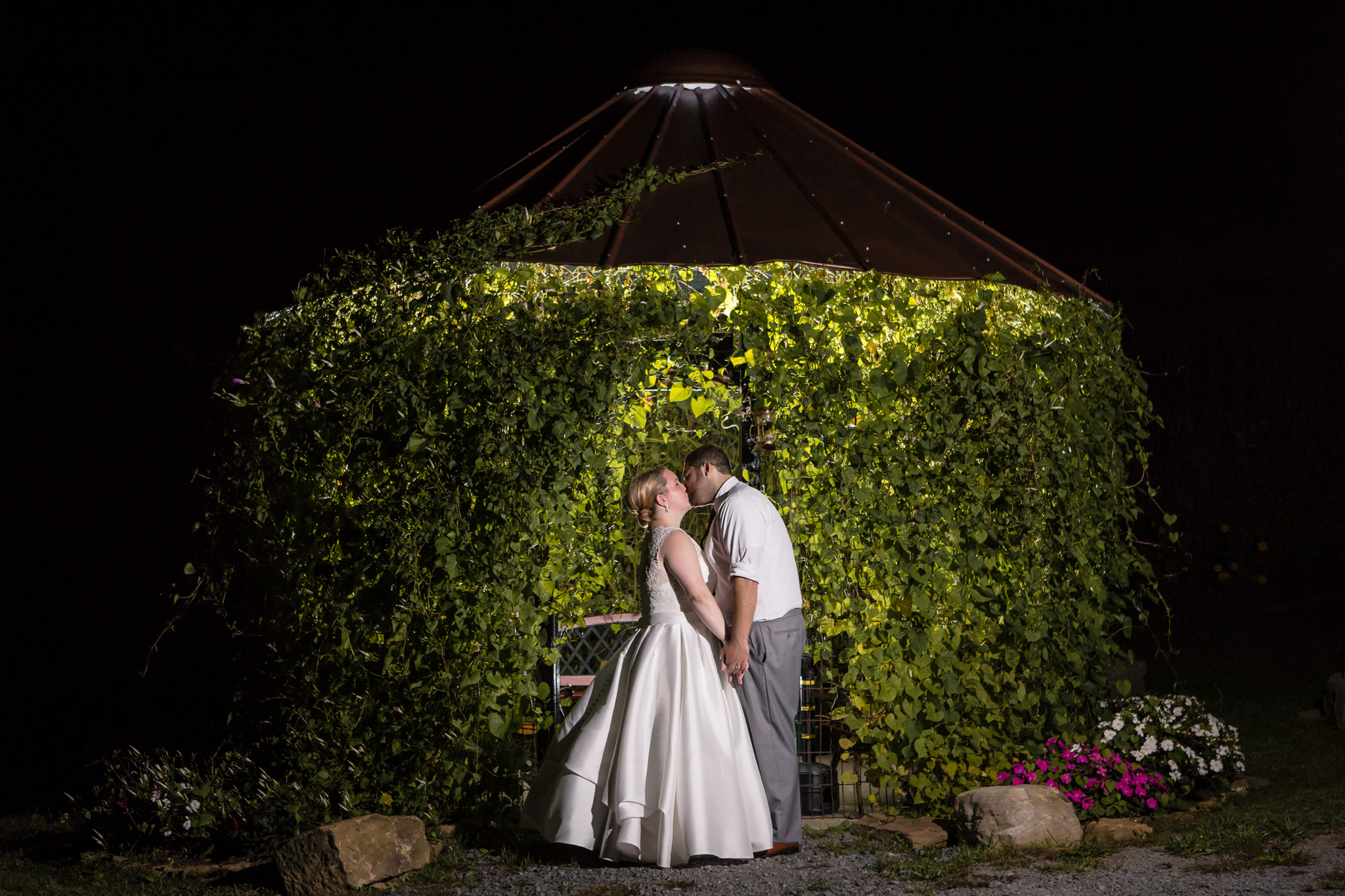 Night portrait in front of an ivy covered gazebo at the Barn at Soergel Hollow