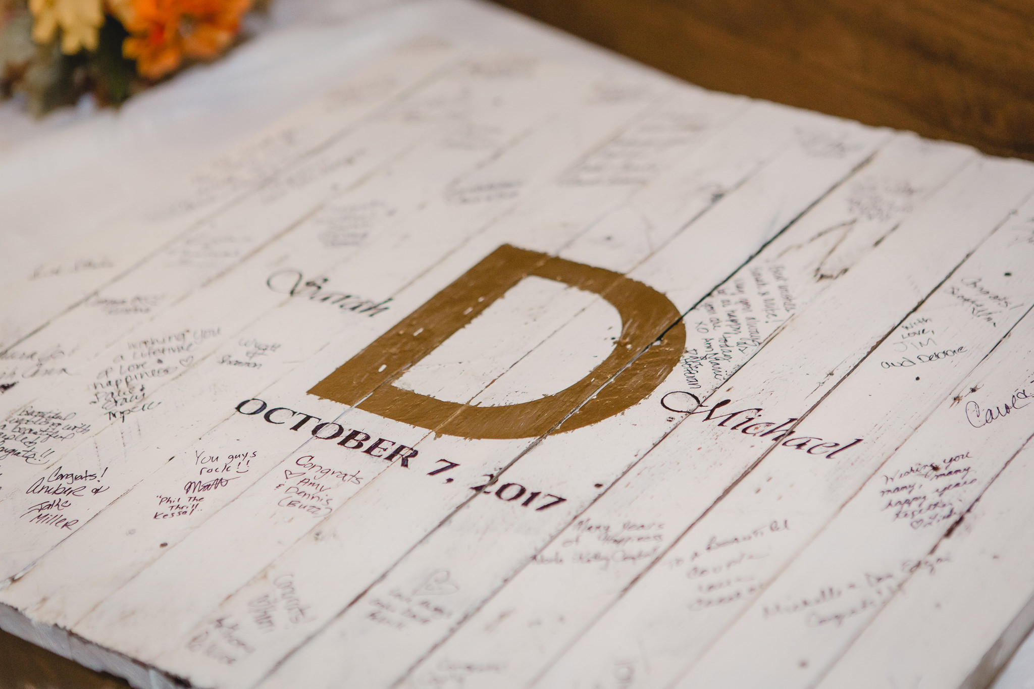 Custom wood sign as the guest book at a Barn at Soergel Hollow wedding