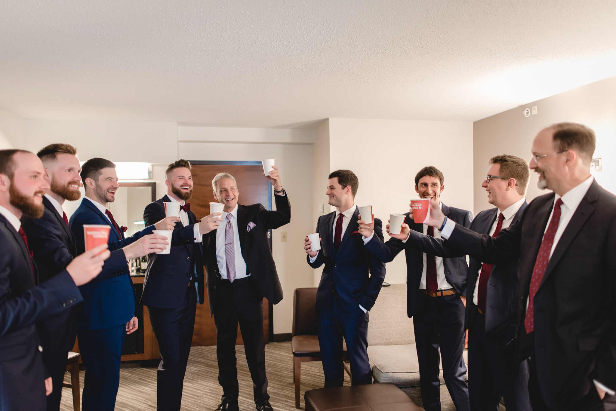 Groomsmen and fathers toast the groom before heading to the Chadwick for his wedding