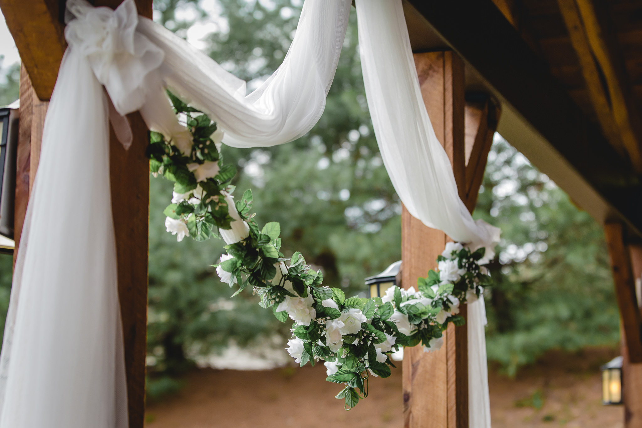 Floral decor and white drapery at a Chadwick wedding ceremony