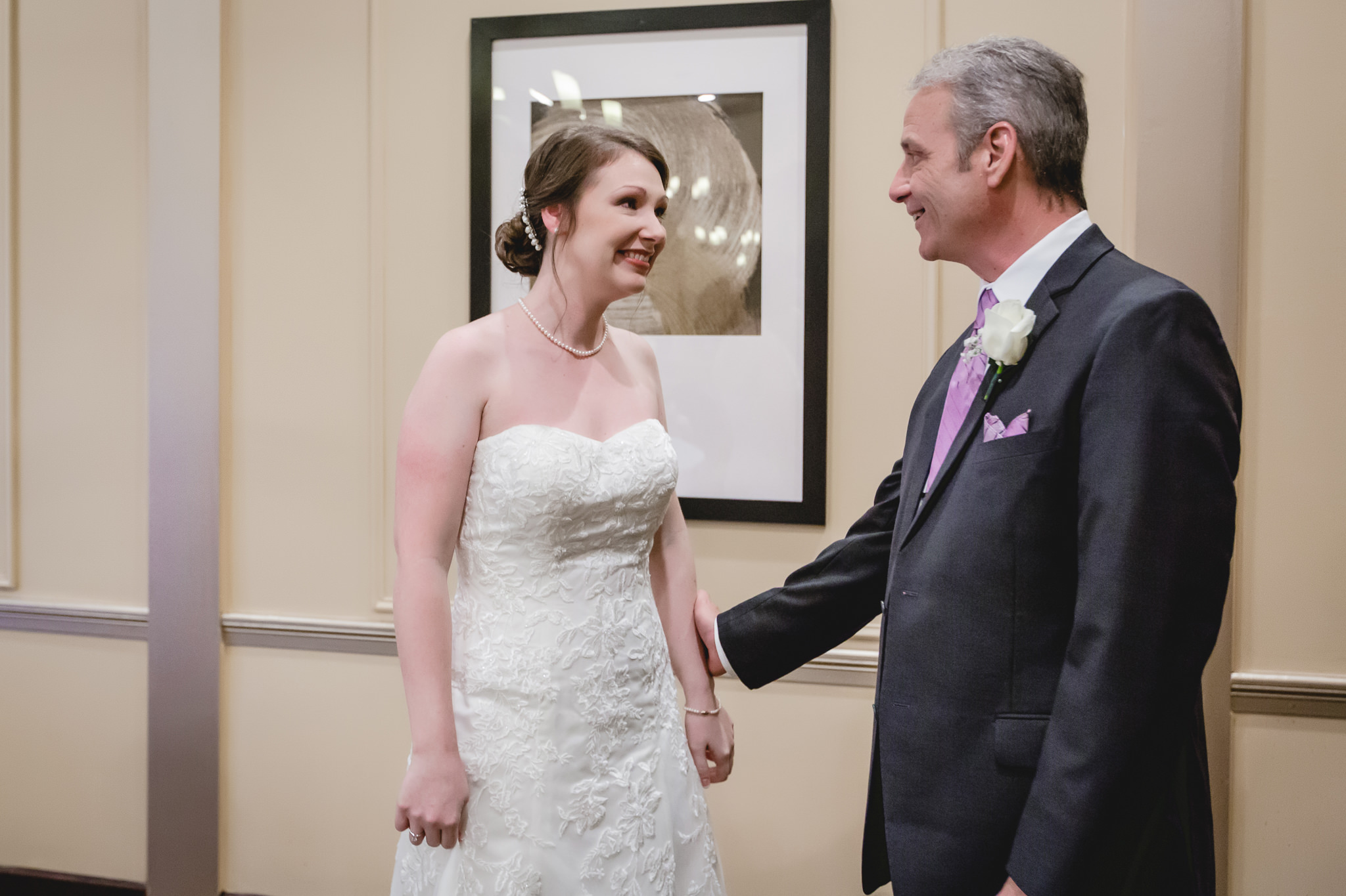 Bride smiles at her father before her Chadwick wedding ceremony