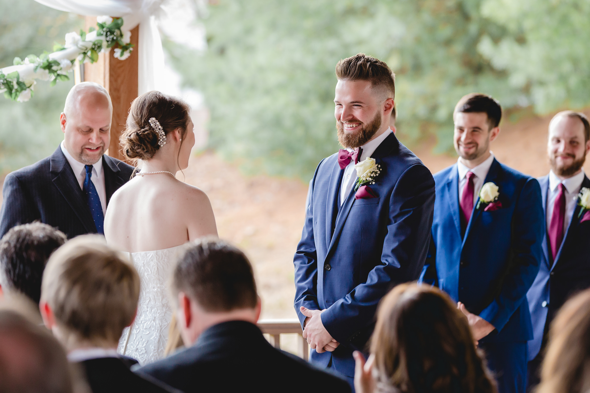 Groom laughs during his wedding ceremony at the Chadwick