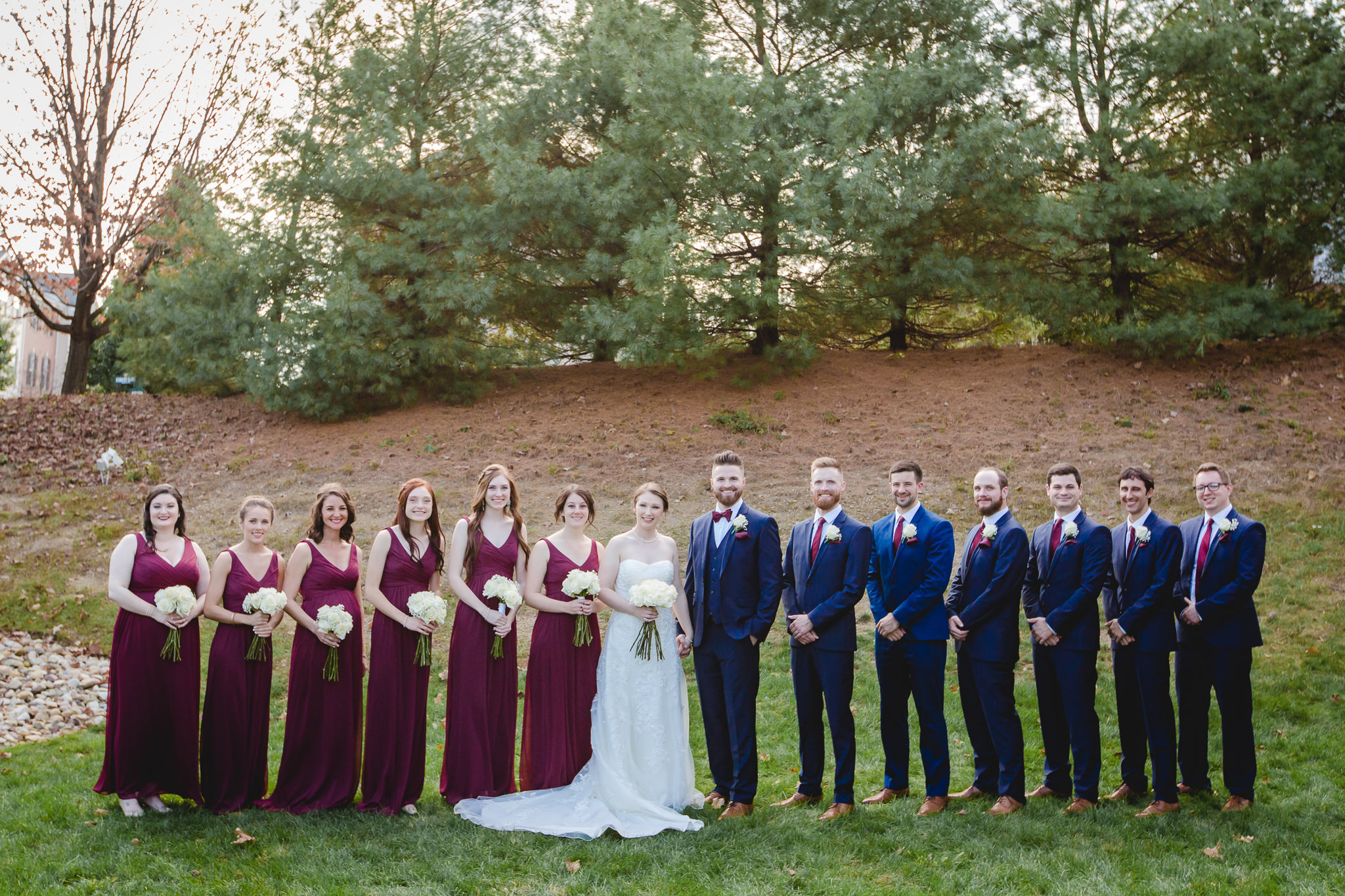 Bridal party in wine and navy at an October wedding at the Chadwick