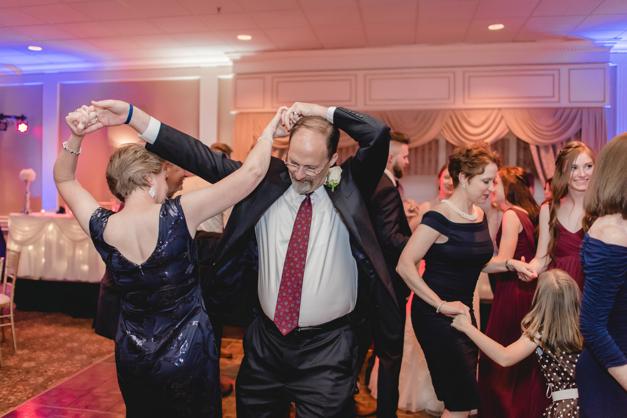 Parents of the groom dance at their son's wedding reception at the Chadwick