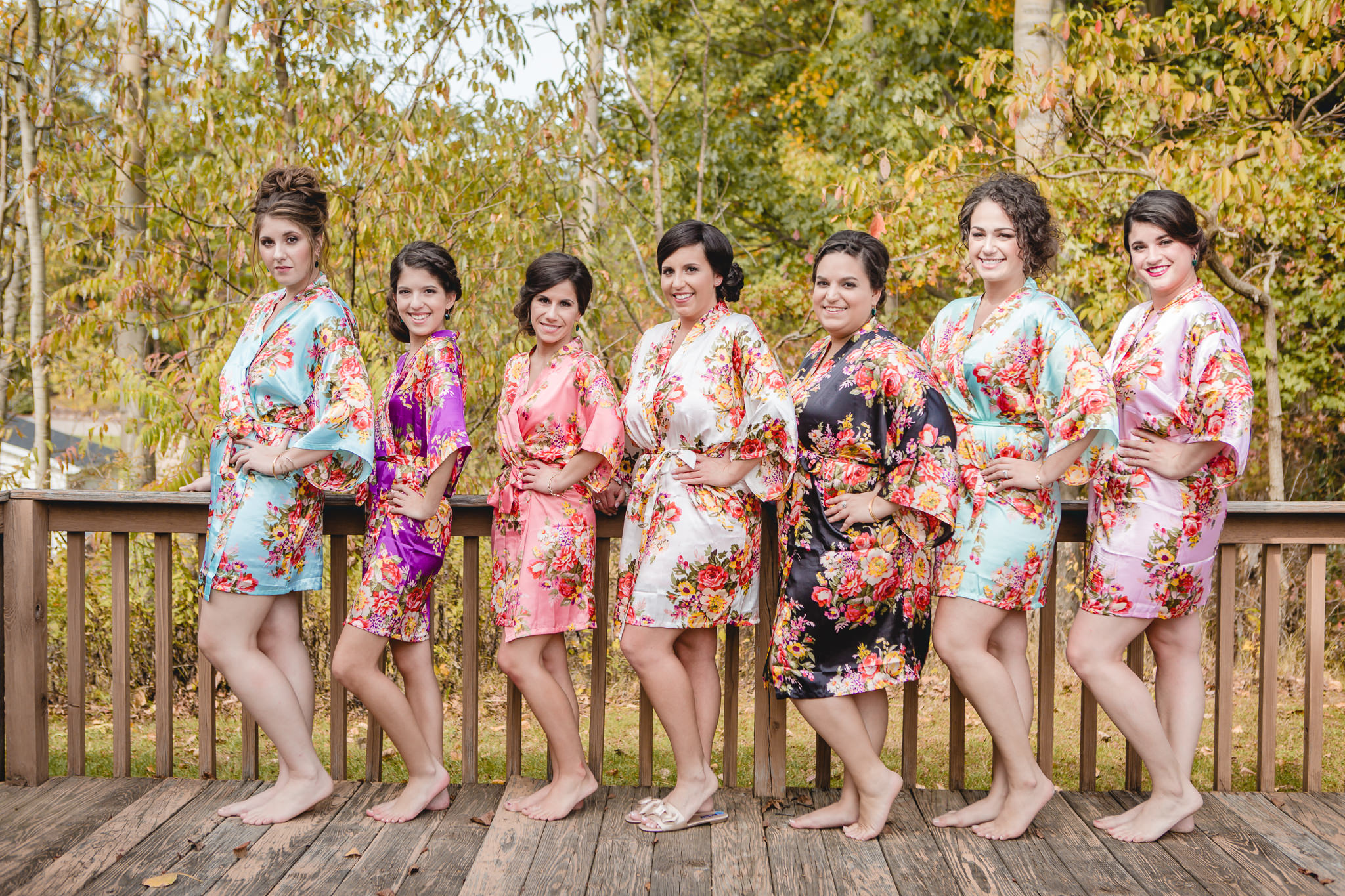 Bride with bridesmaids in silk kimonos before her DoubleTree Pittsburgh Airport wedding