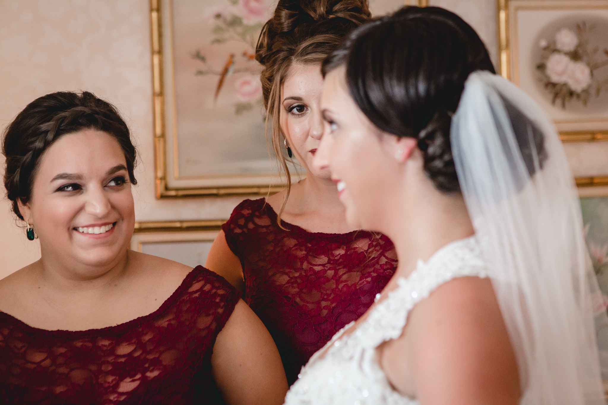 Maid of honor smiles at her sister before her DoubleTree Pittsburgh Airport wedding