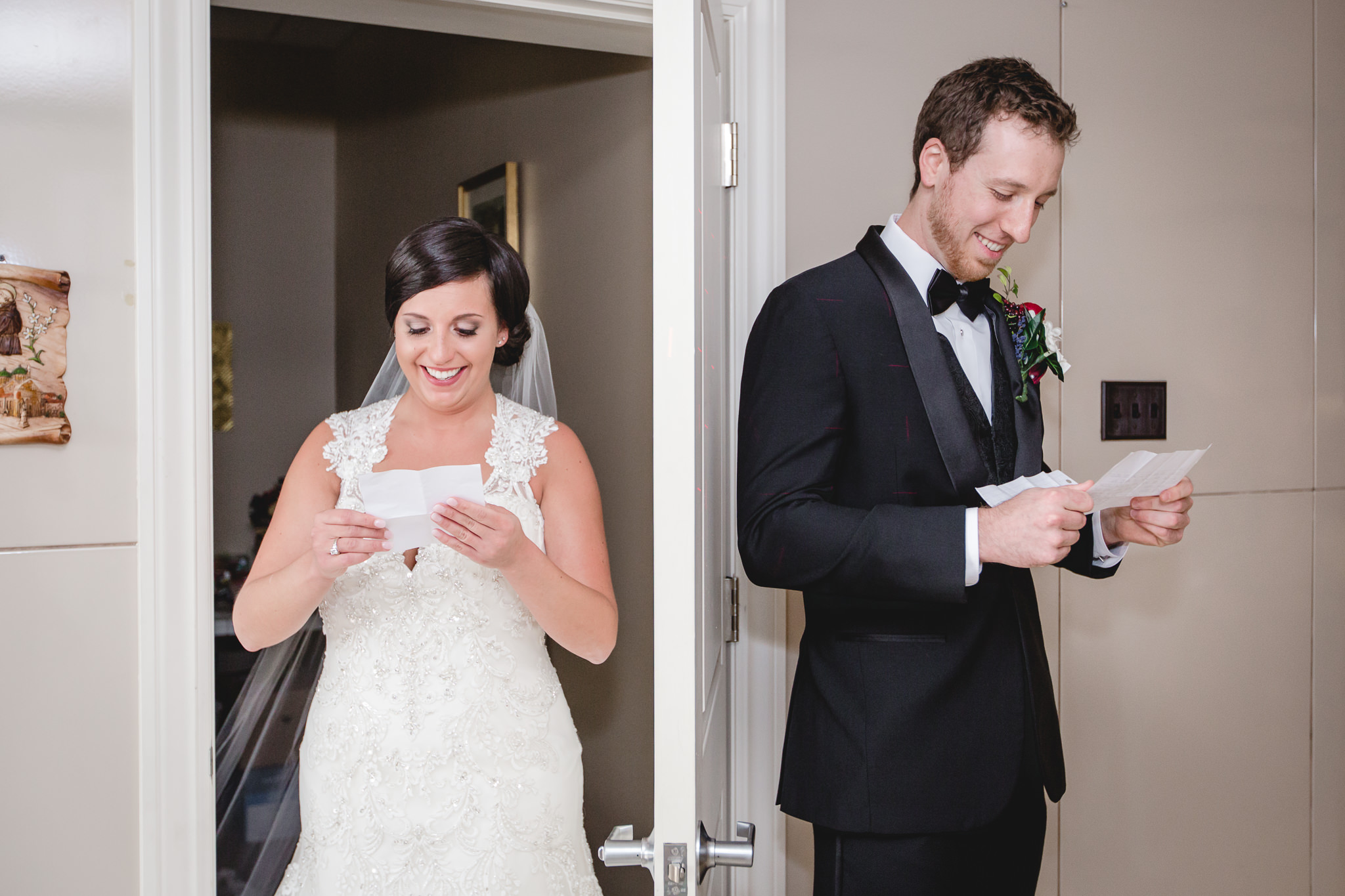 Bride and groom read letters to each other behind a door at St. John the Baptist