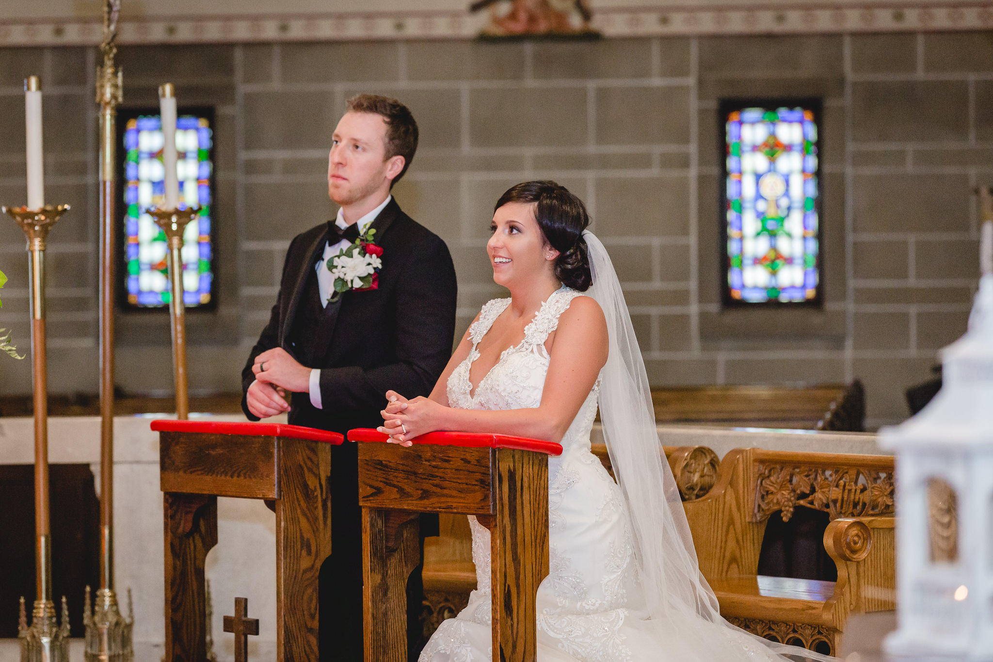 Bride and groom during their wedding ceremony at St. John the Baptist