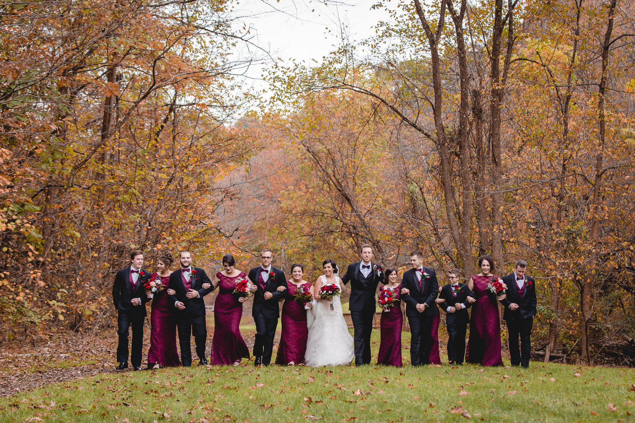 Bridal party strolls together through a park in Moon Township