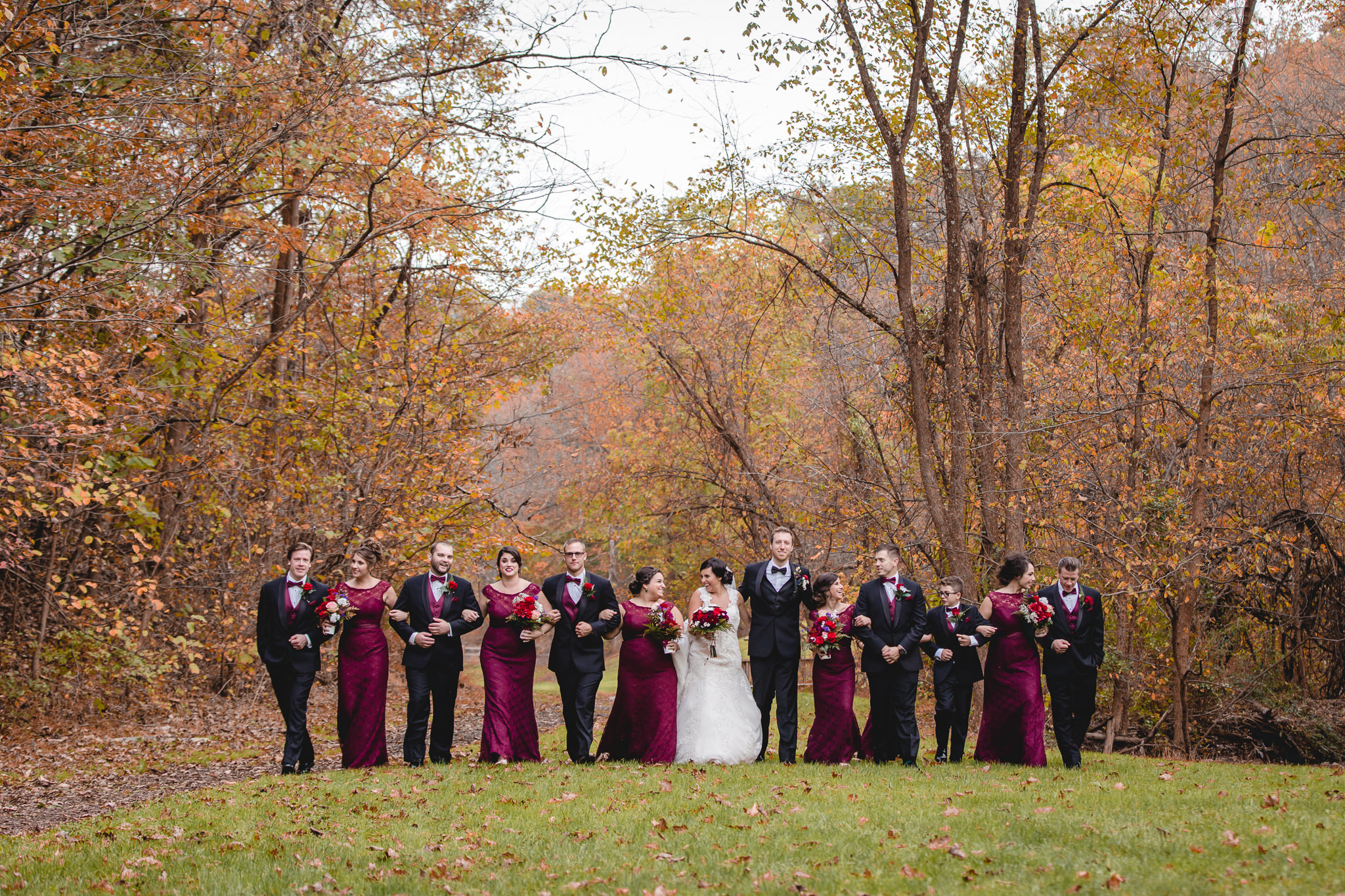 Bridal party in a park wearing burgundy for an October wedding in Moon Township