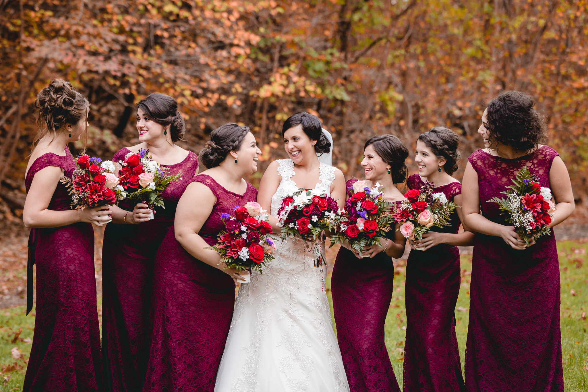 Bride laughs with her bridesmaids before her October wedding at DoubleTree Pittsburgh Airport
