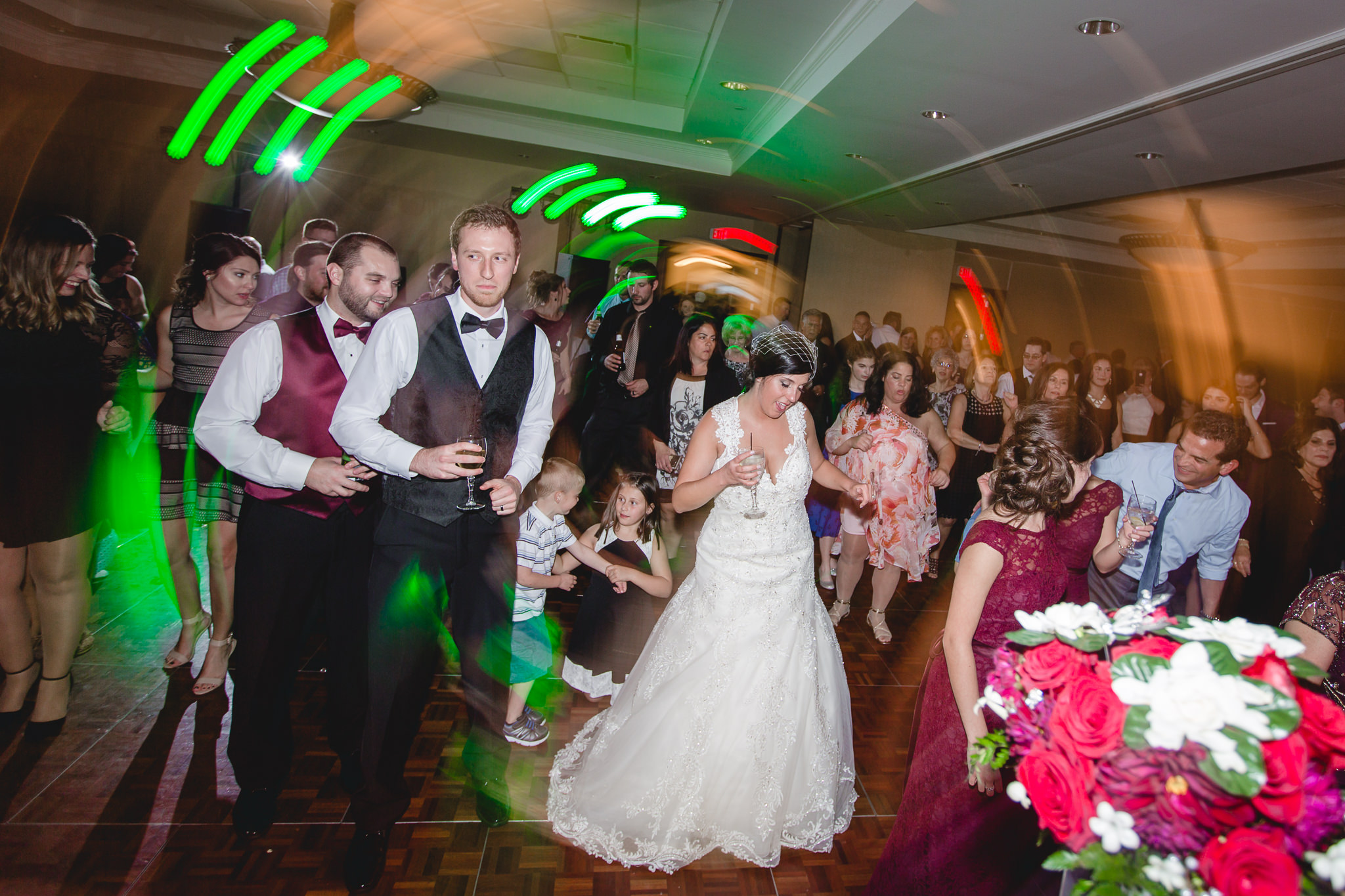 Dance floor with trailing DJ lights at a DoubleTree Pittsburgh Airport wedding