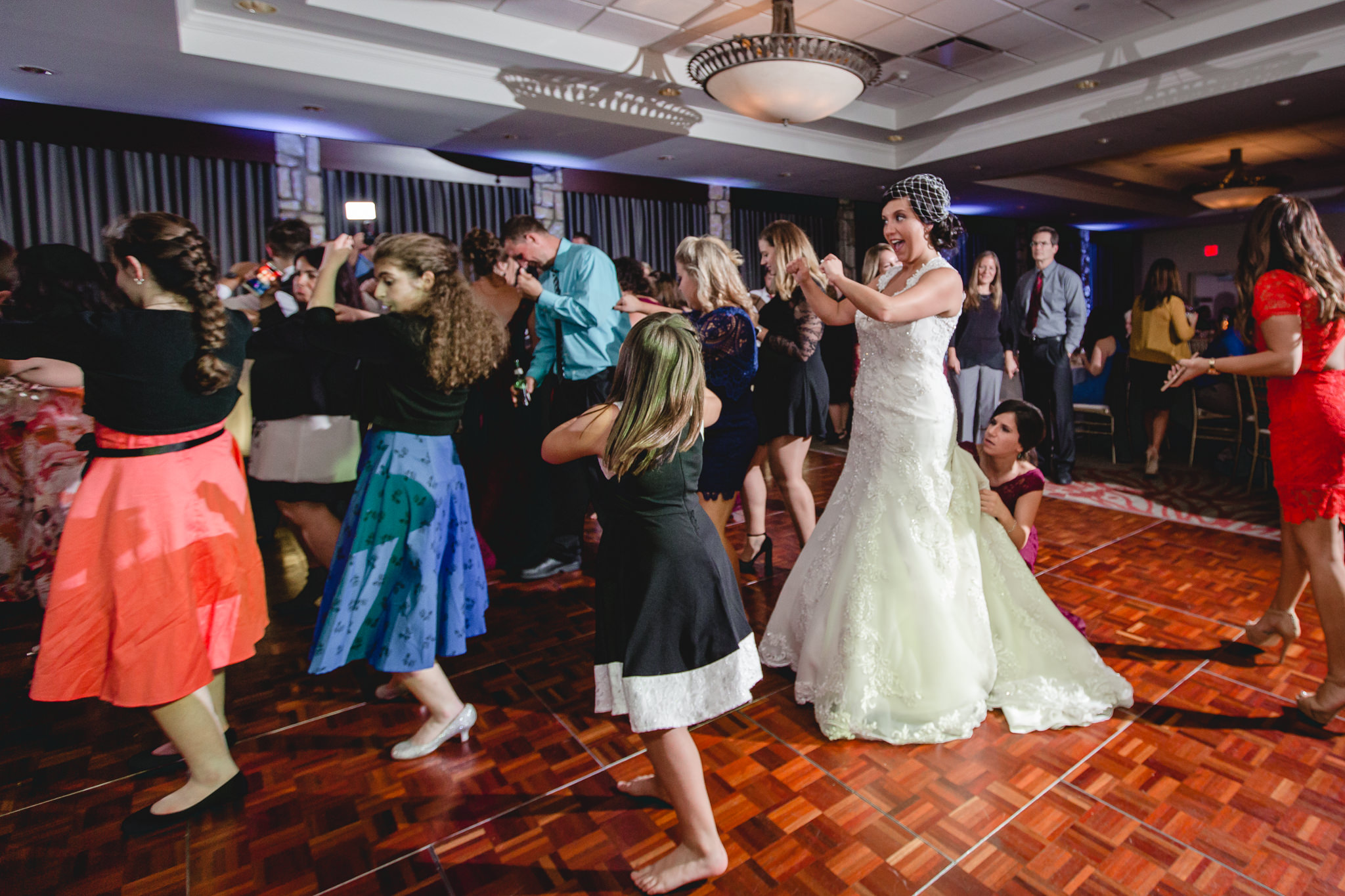Bride dances with guests at a DoubleTree Pittsburgh Airport wedding