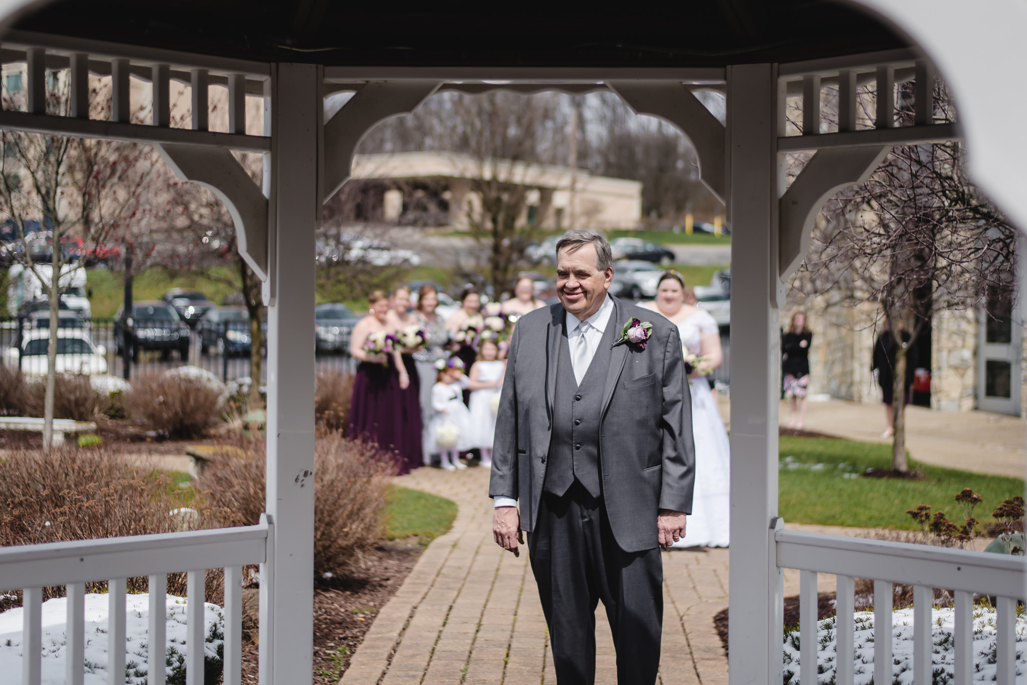 Father of the bride waits to see his daughter in her wedding dress