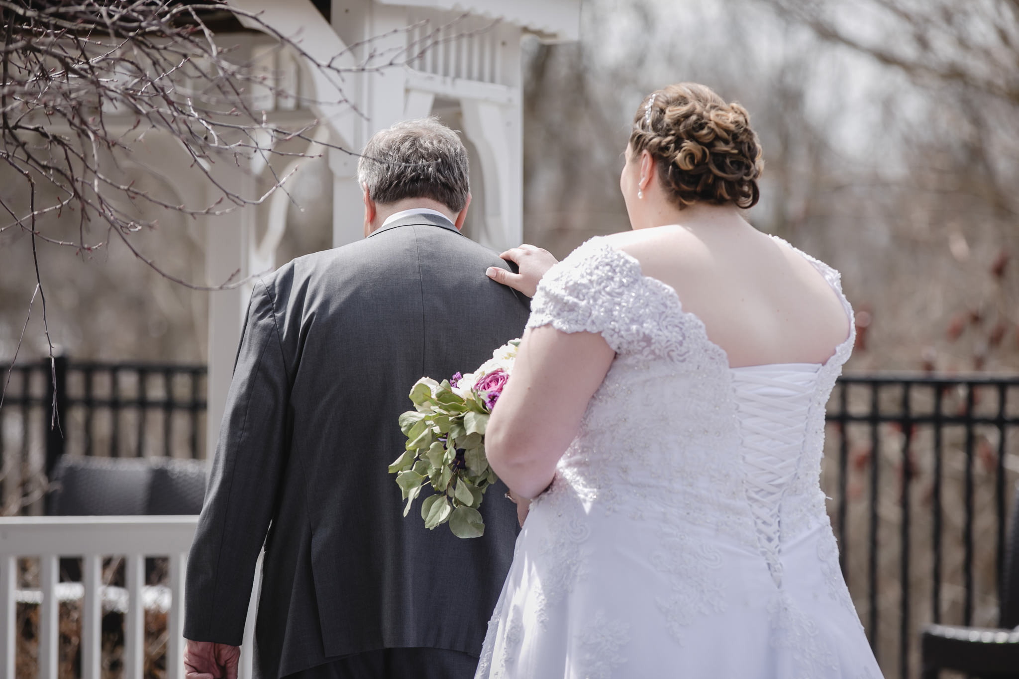 Bride taps her father on the shoulder for a first look at the DoubleTree in Moon Township