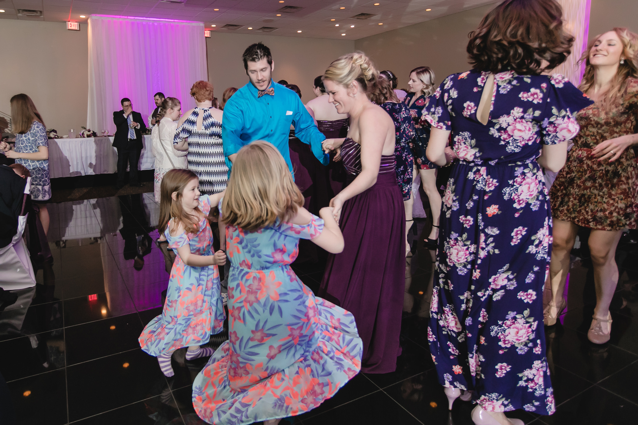 Bridesmaid dances with her family at a Fez wedding reception