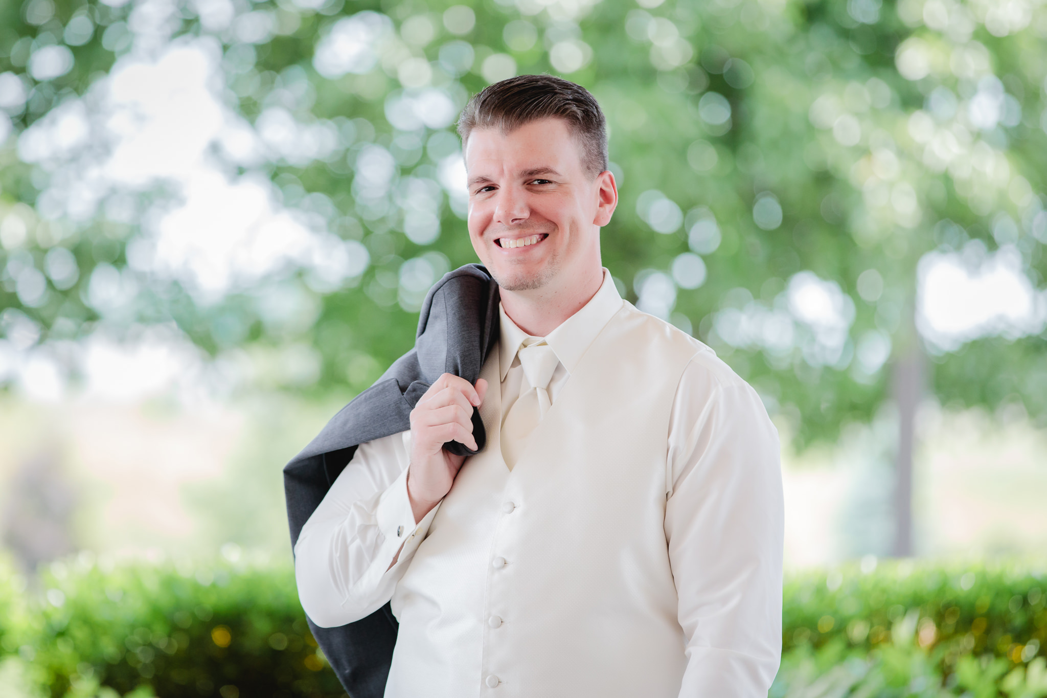 Groom poses in his vest at Chestnut Ridge Golf Resort