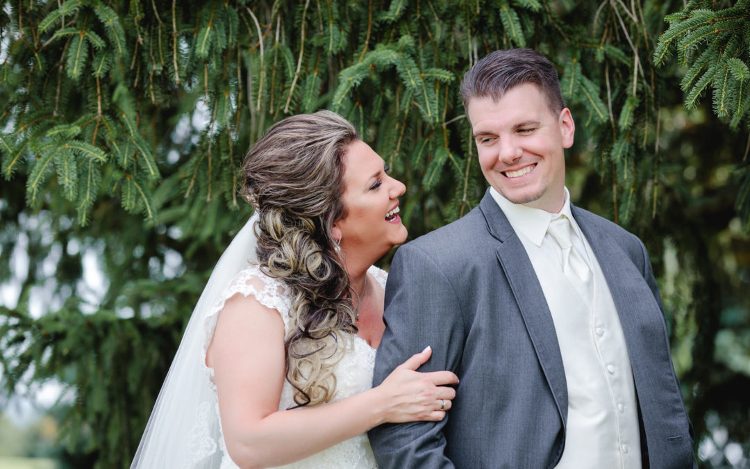 Bride & groom laugh together at Chestnut Ridge Golf Resort