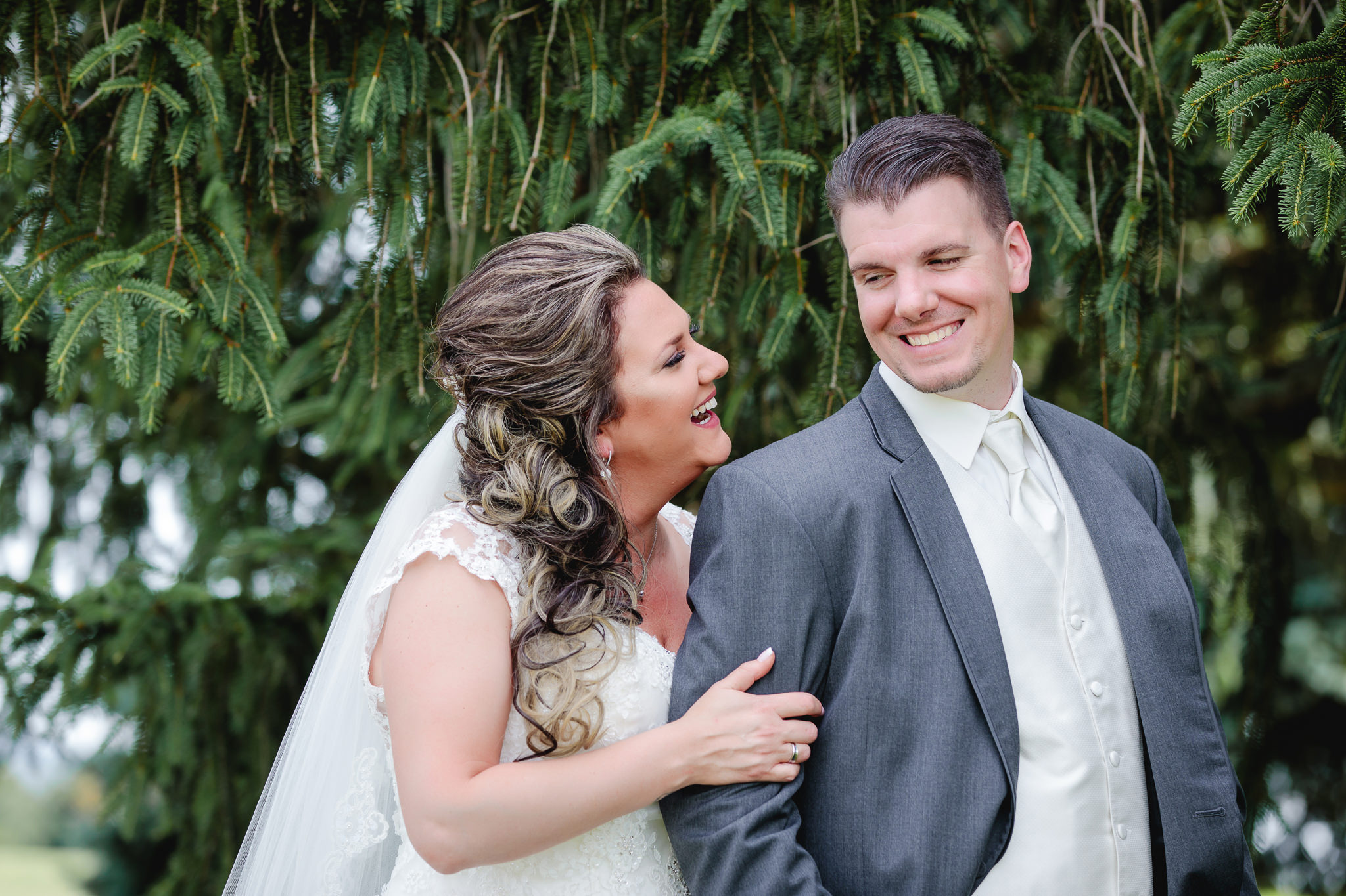 Bride & groom laugh together at Chestnut Ridge Golf Resort