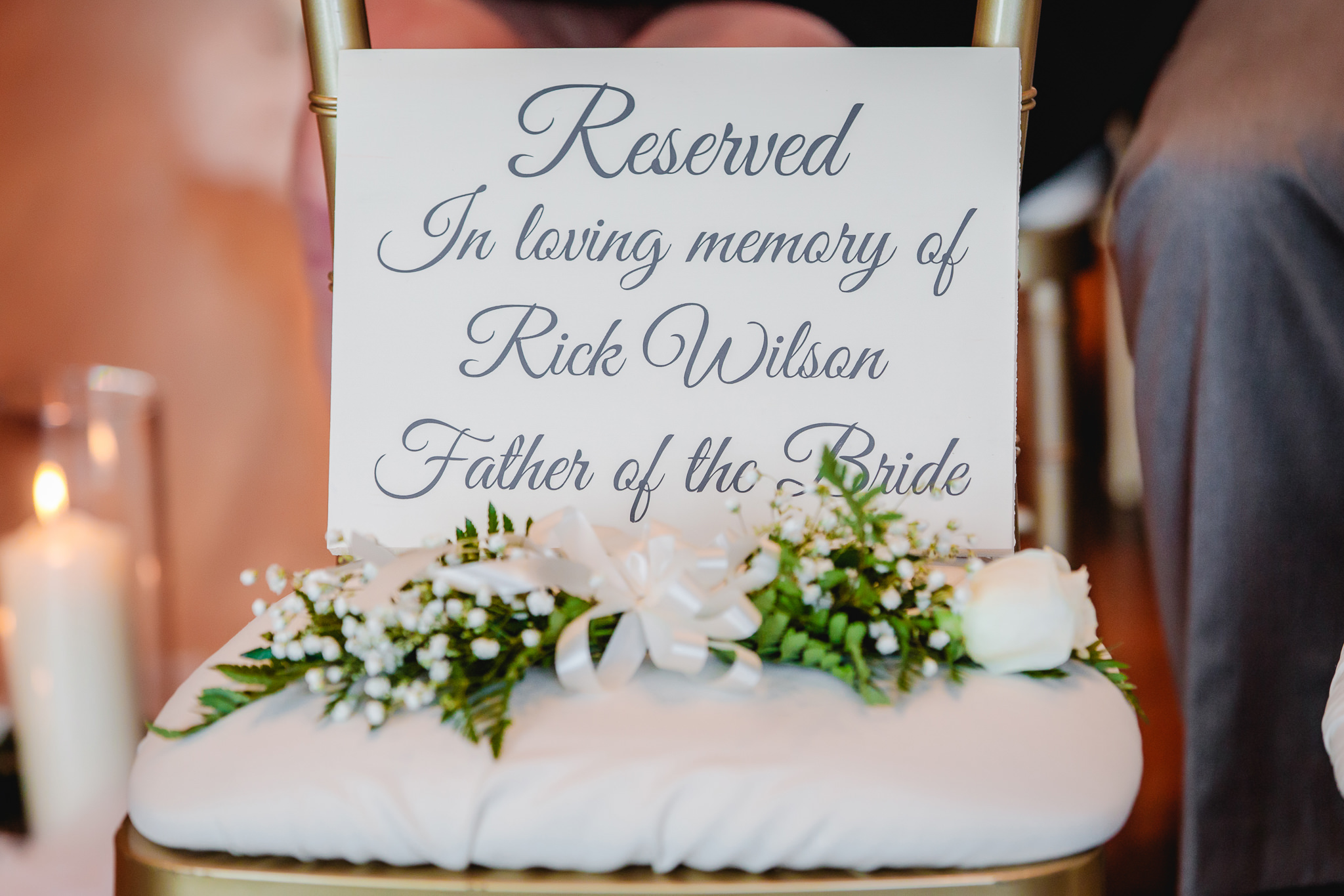Reservation sign during ceremony for bride's late father