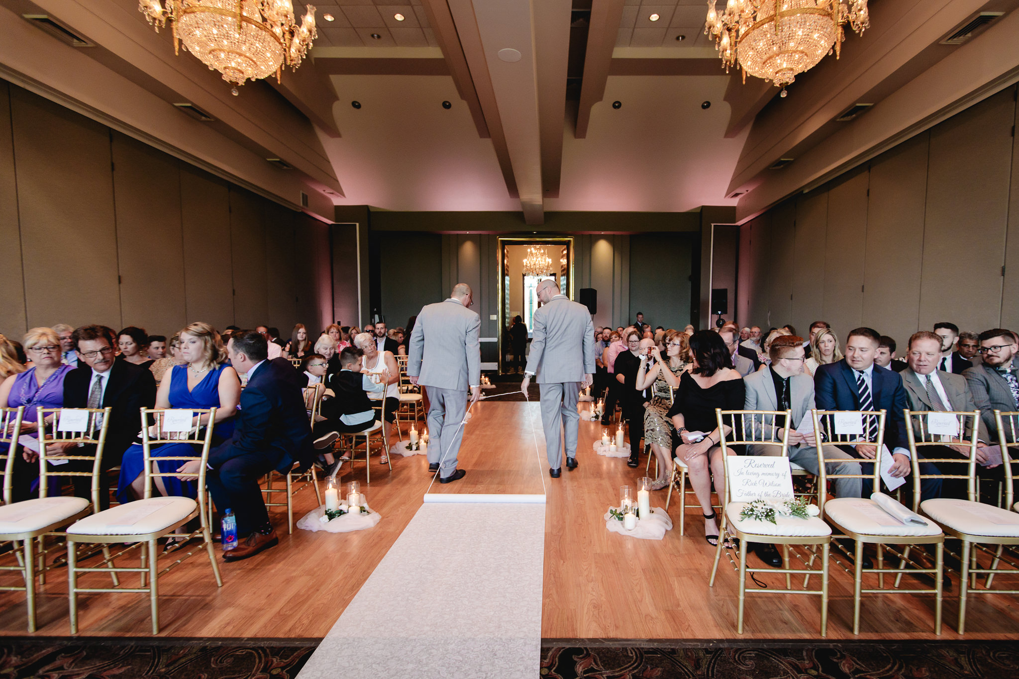 Groomsmen roll out the crash at a Chestnut Ridge Golf Resort wedding ceremony