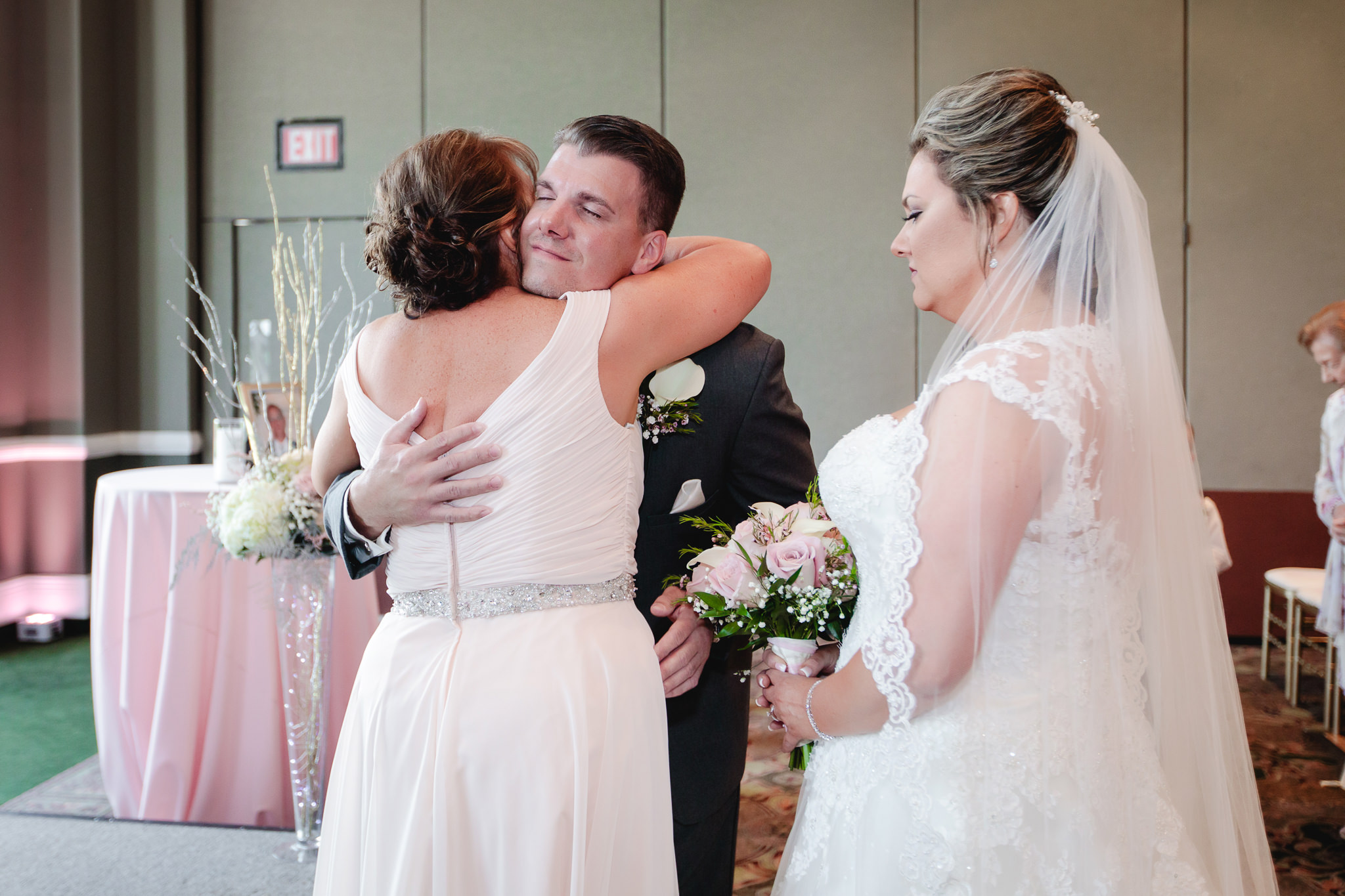 Groom hugs the mother of the bride at Chestnut Ridge Golf Resort