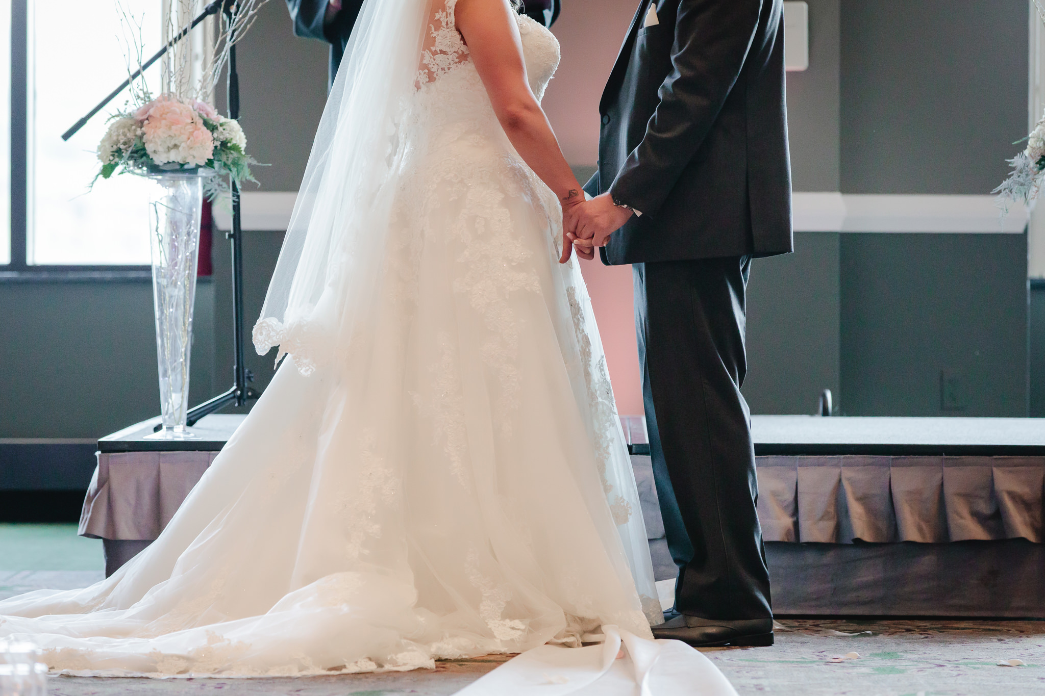 Bride and groom hold hands at Chestnut Ridge Golf Resort